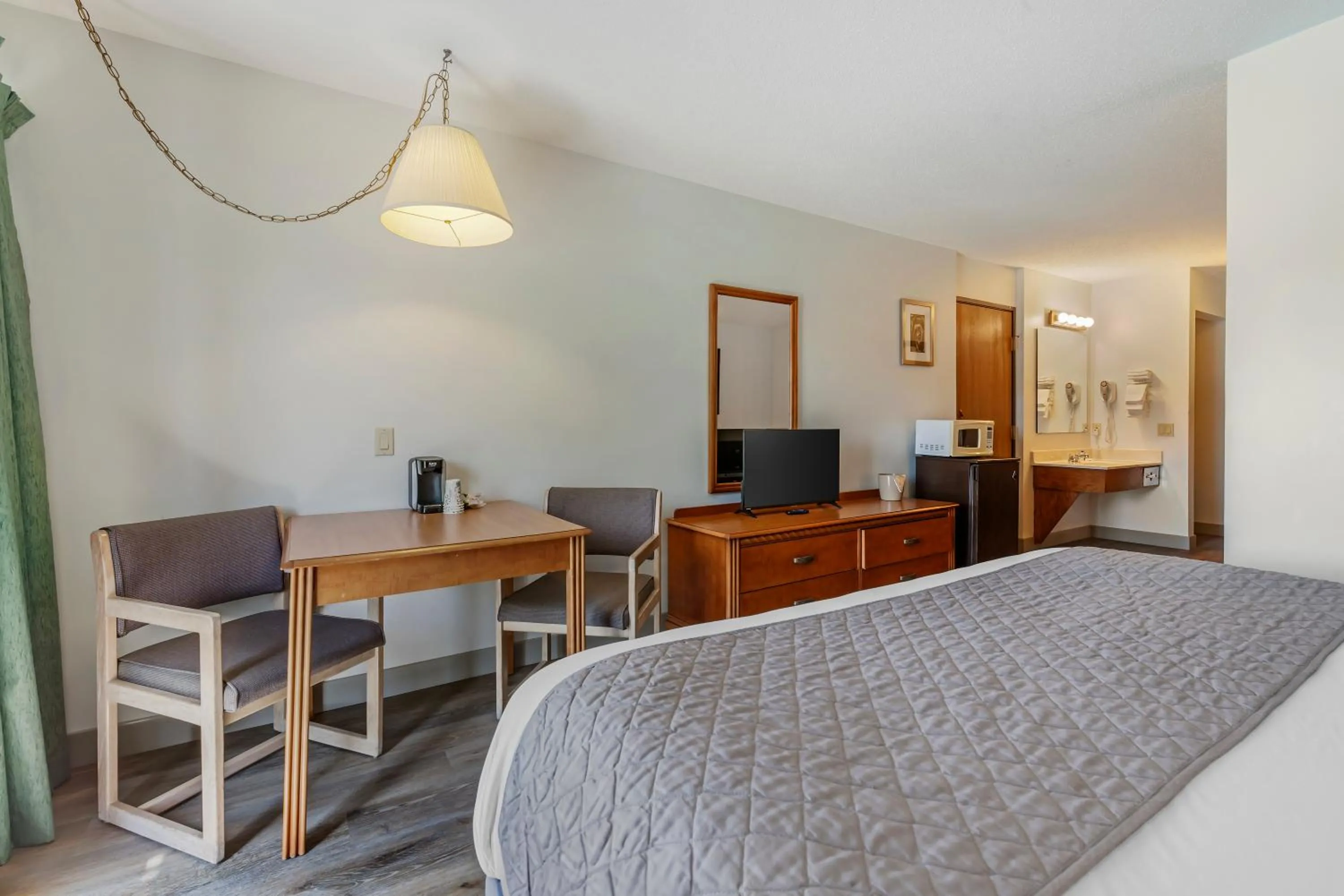 Bedroom in Polynesian Hotel & Suites