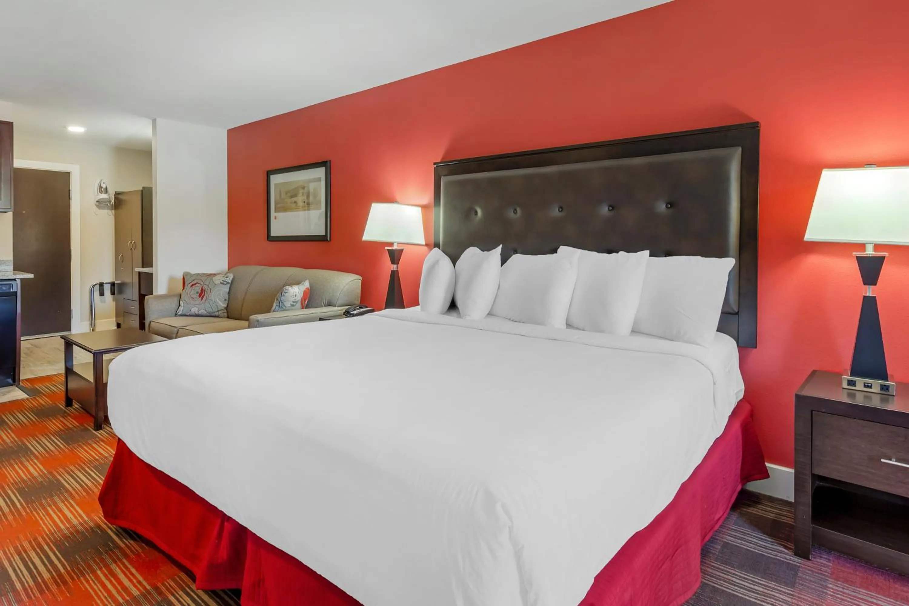 Bed in Polynesian Hotel & Suites