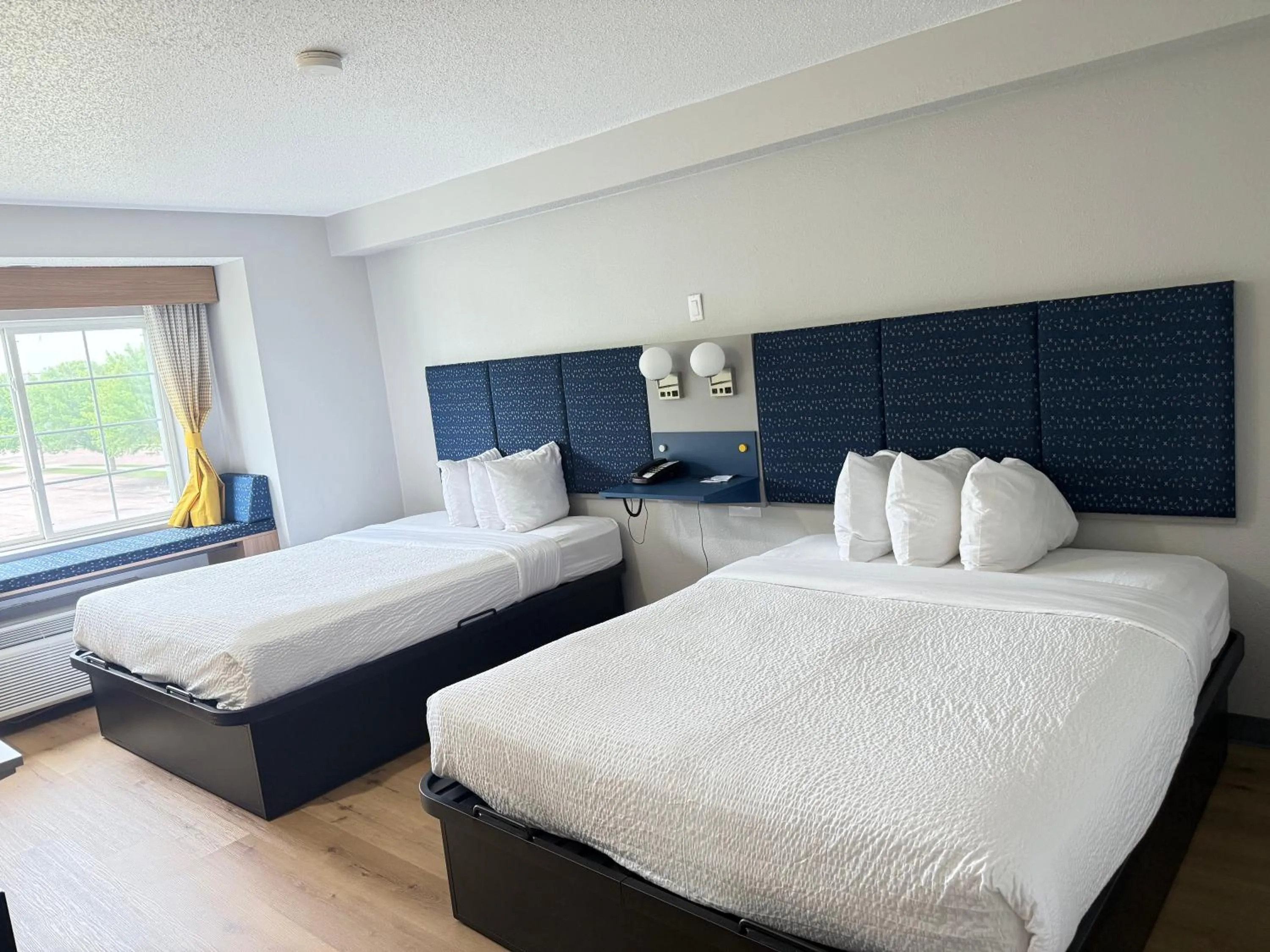 Bed in Microtel Inn & Suites by Wyndham Sioux Falls