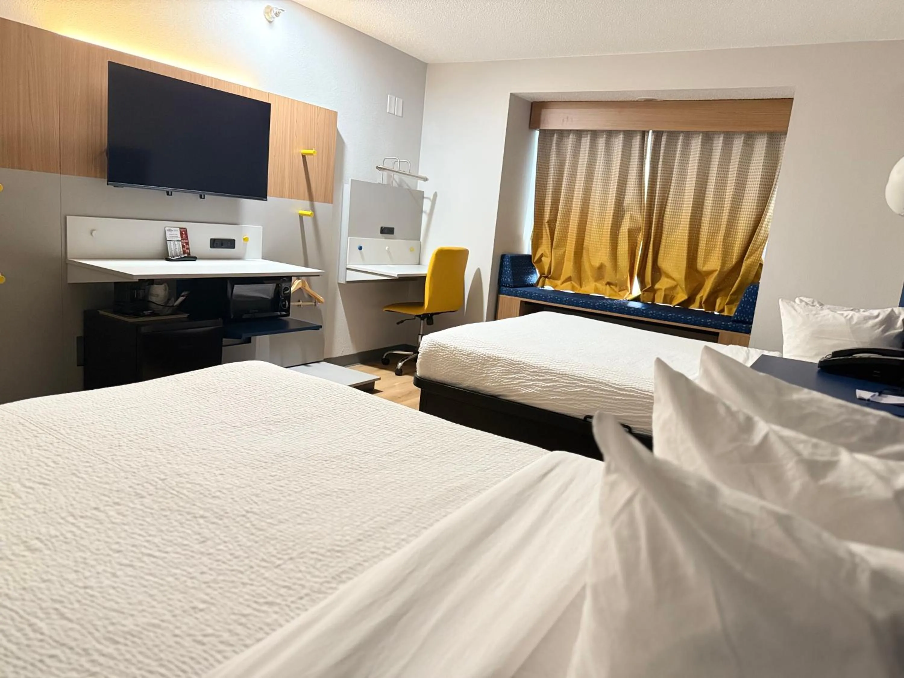 Bed in Microtel Inn & Suites by Wyndham Sioux Falls