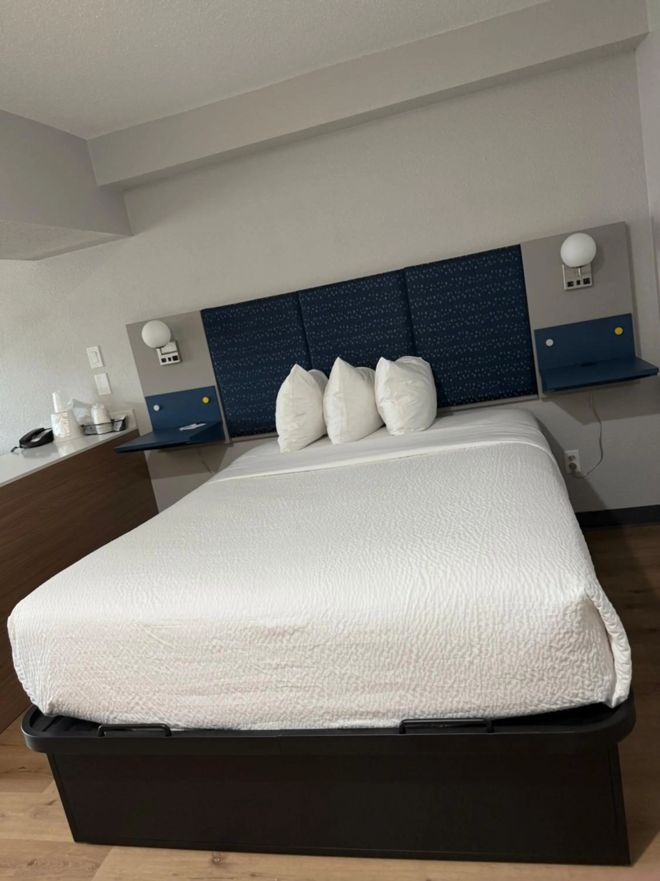 Bed in Microtel Inn & Suites by Wyndham Sioux Falls