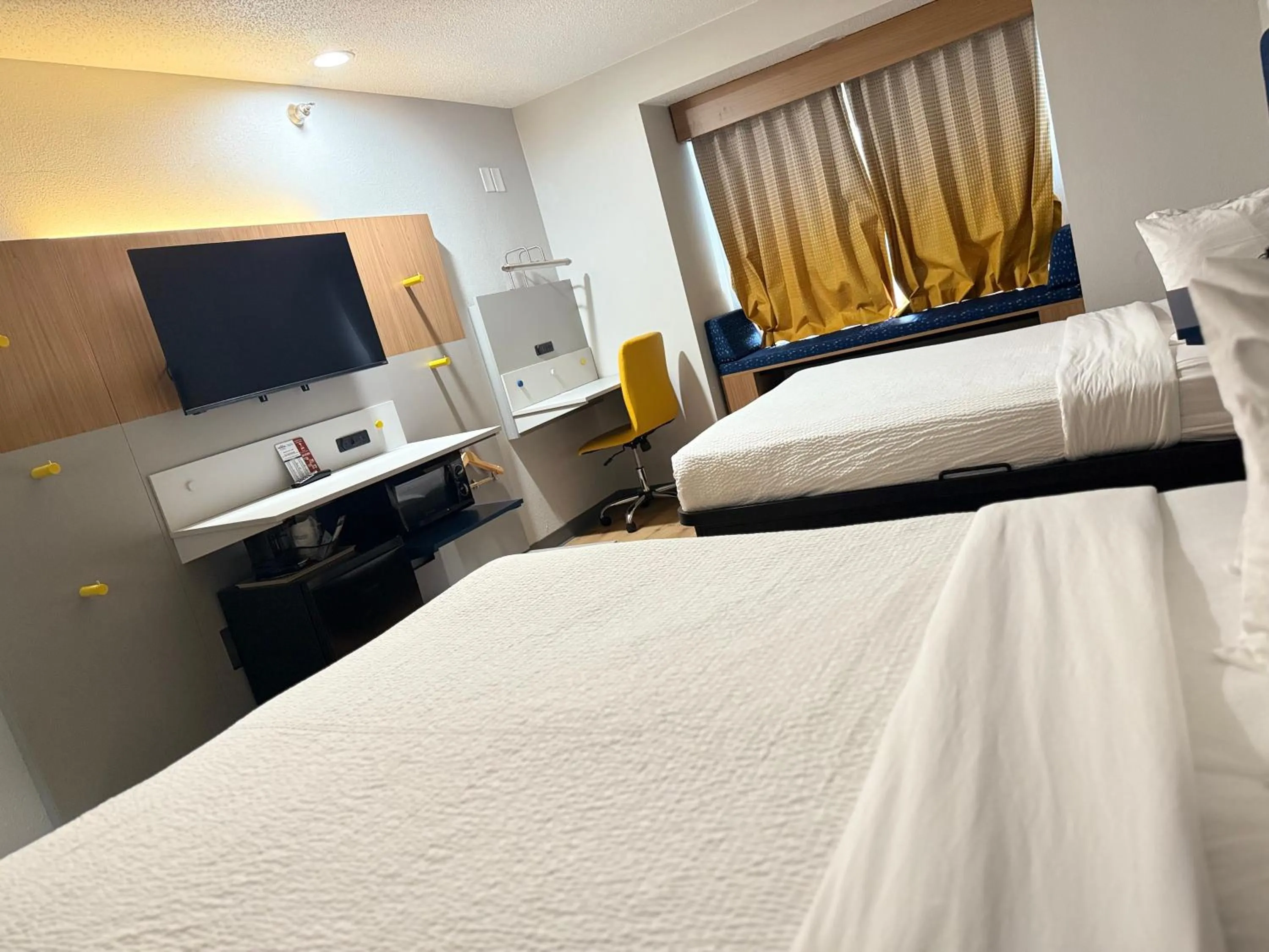 Bed in Microtel Inn & Suites by Wyndham Sioux Falls