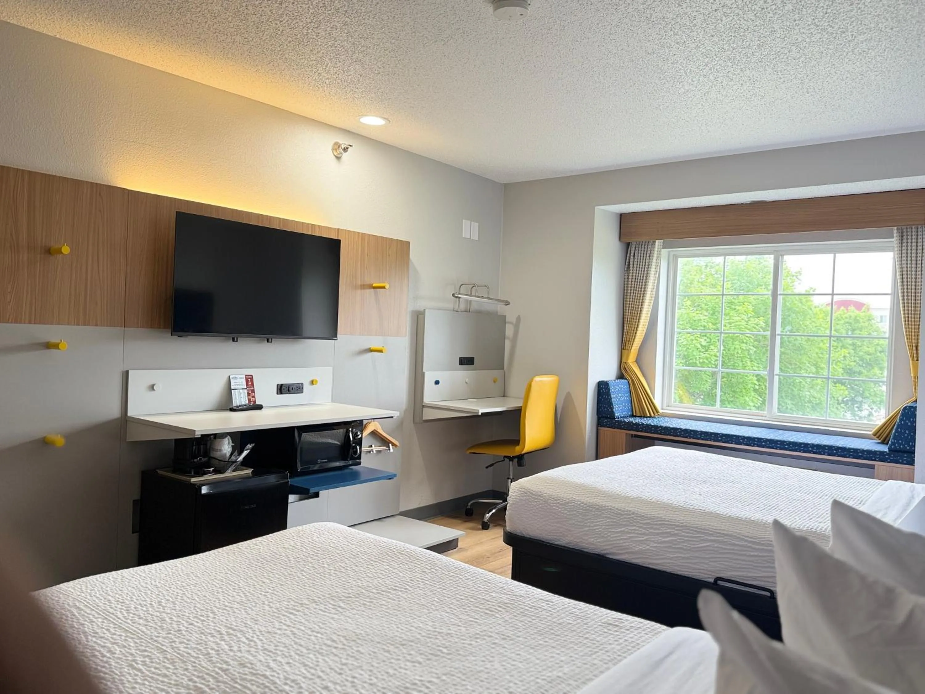 Bed in Microtel Inn & Suites by Wyndham Sioux Falls