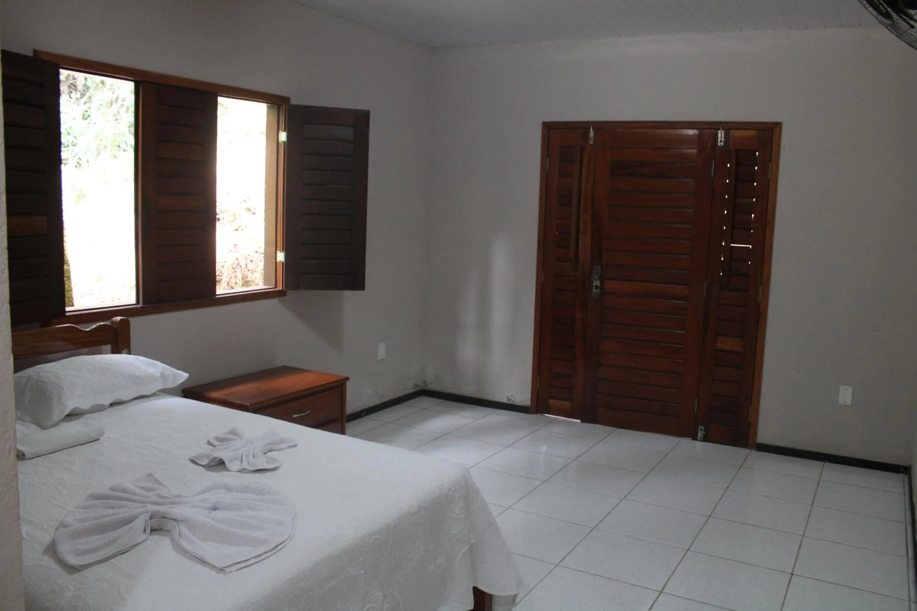 Bed in HOTEL CANTINHO DAS FLORES