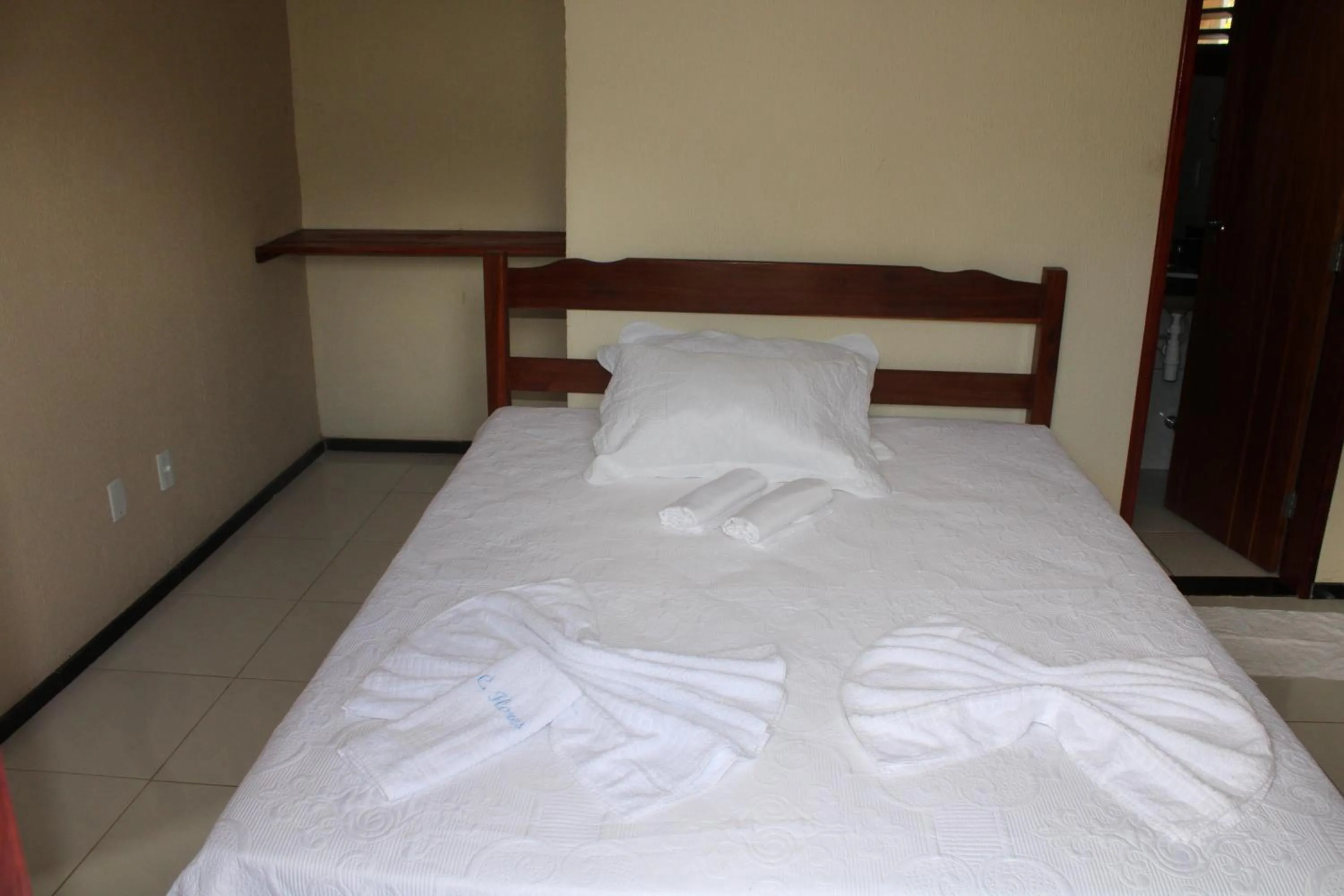 Bed in HOTEL CANTINHO DAS FLORES