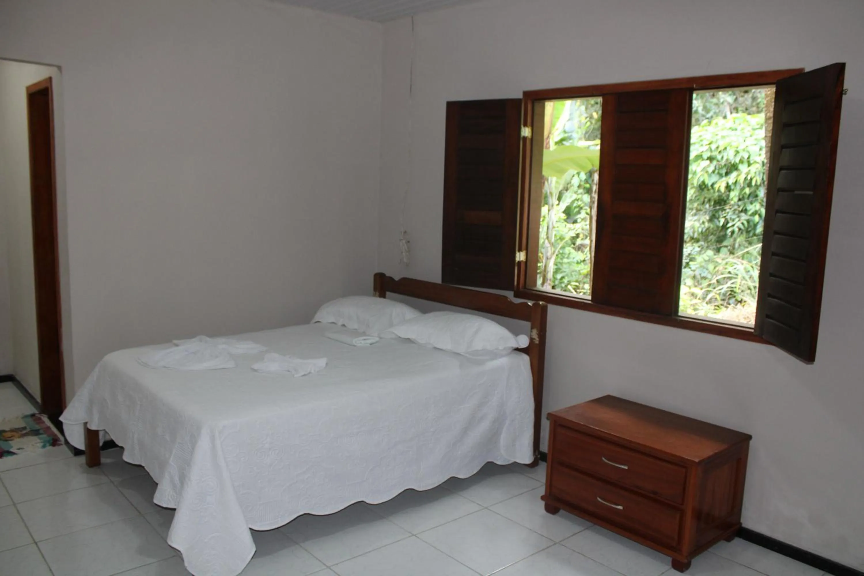 Bed in HOTEL CANTINHO DAS FLORES