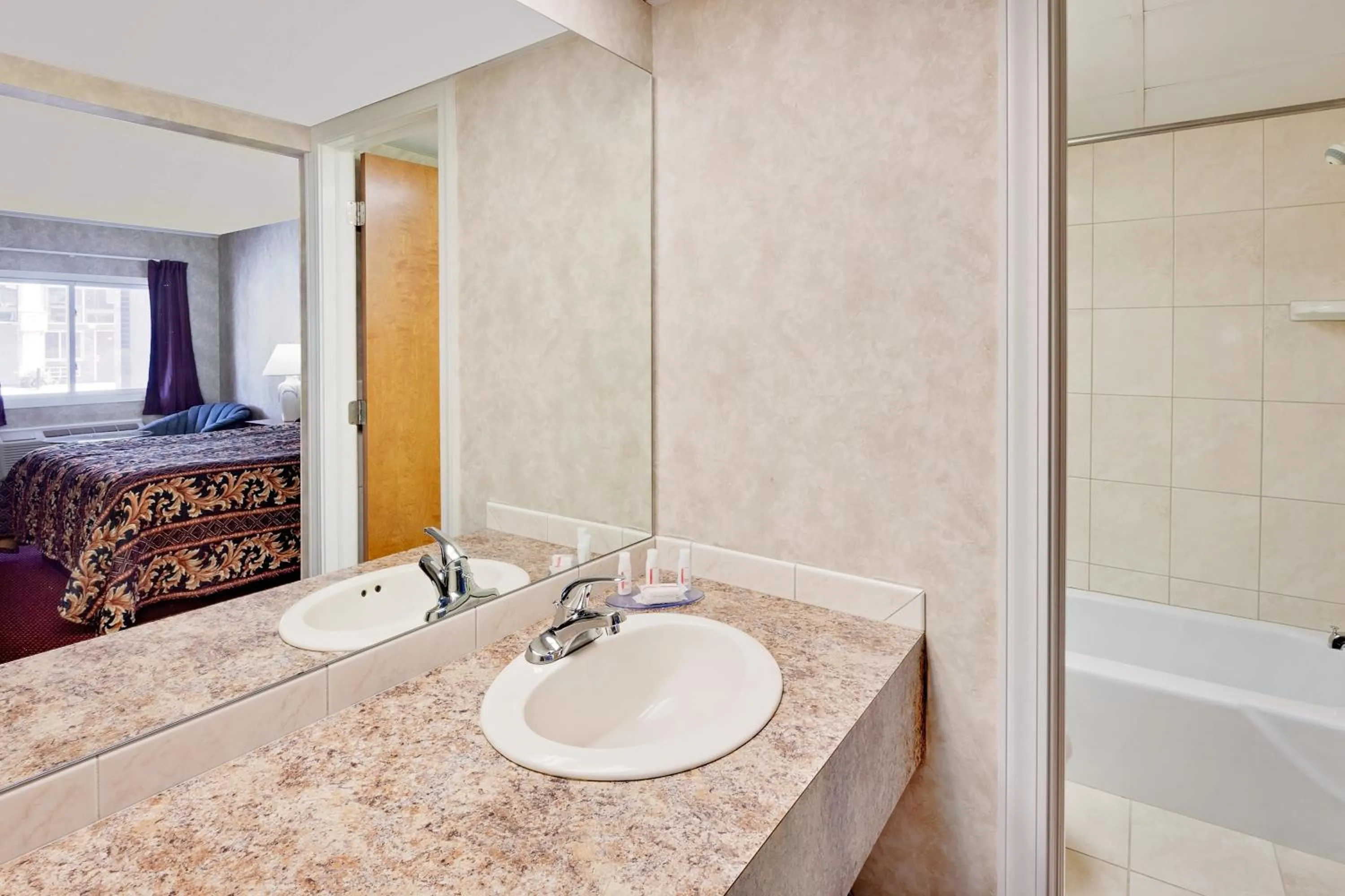 Bathroom, Bed in Super 8 by Wyndham Traverse City