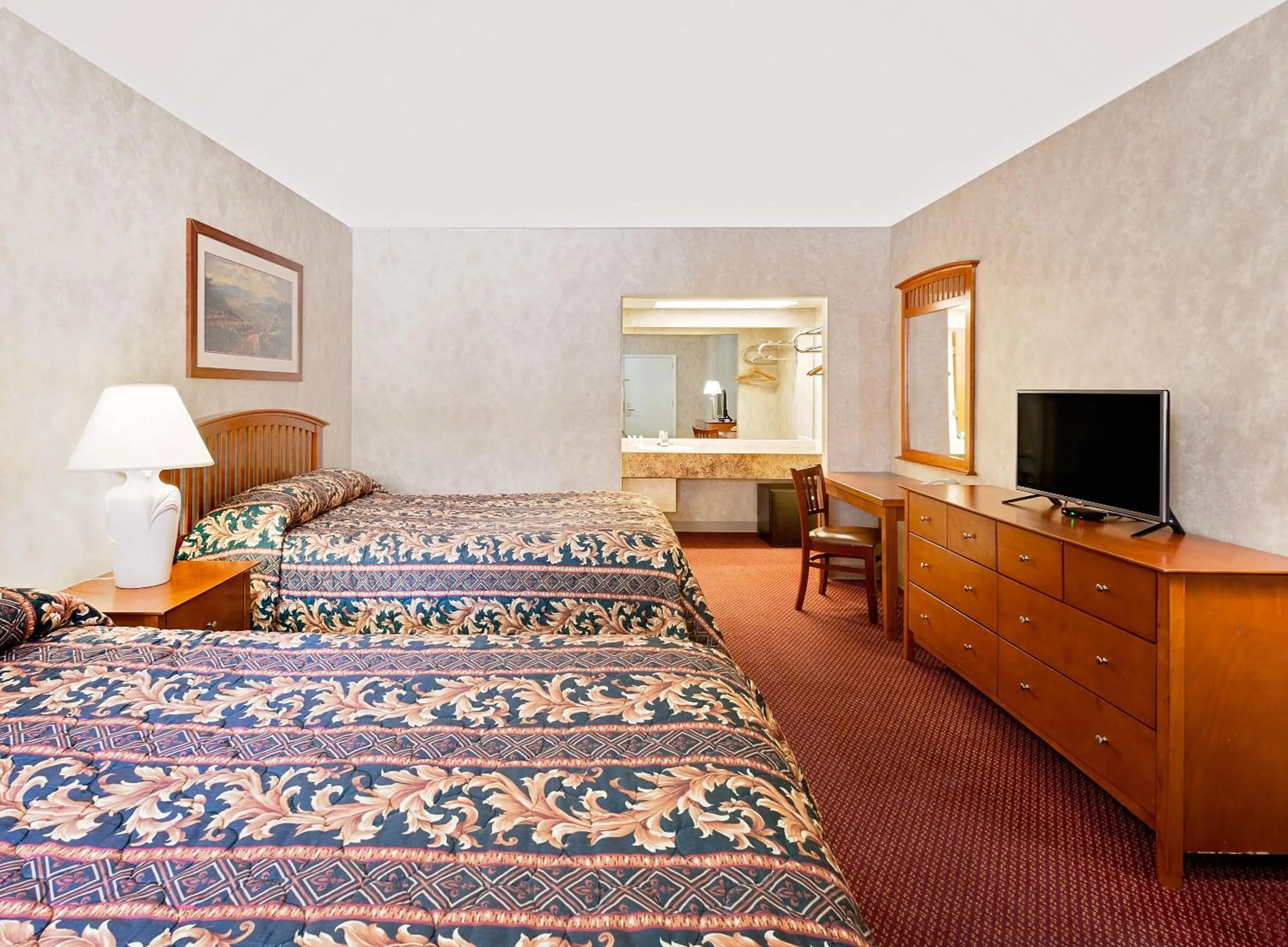 Bathroom, Bed in Super 8 by Wyndham Traverse City