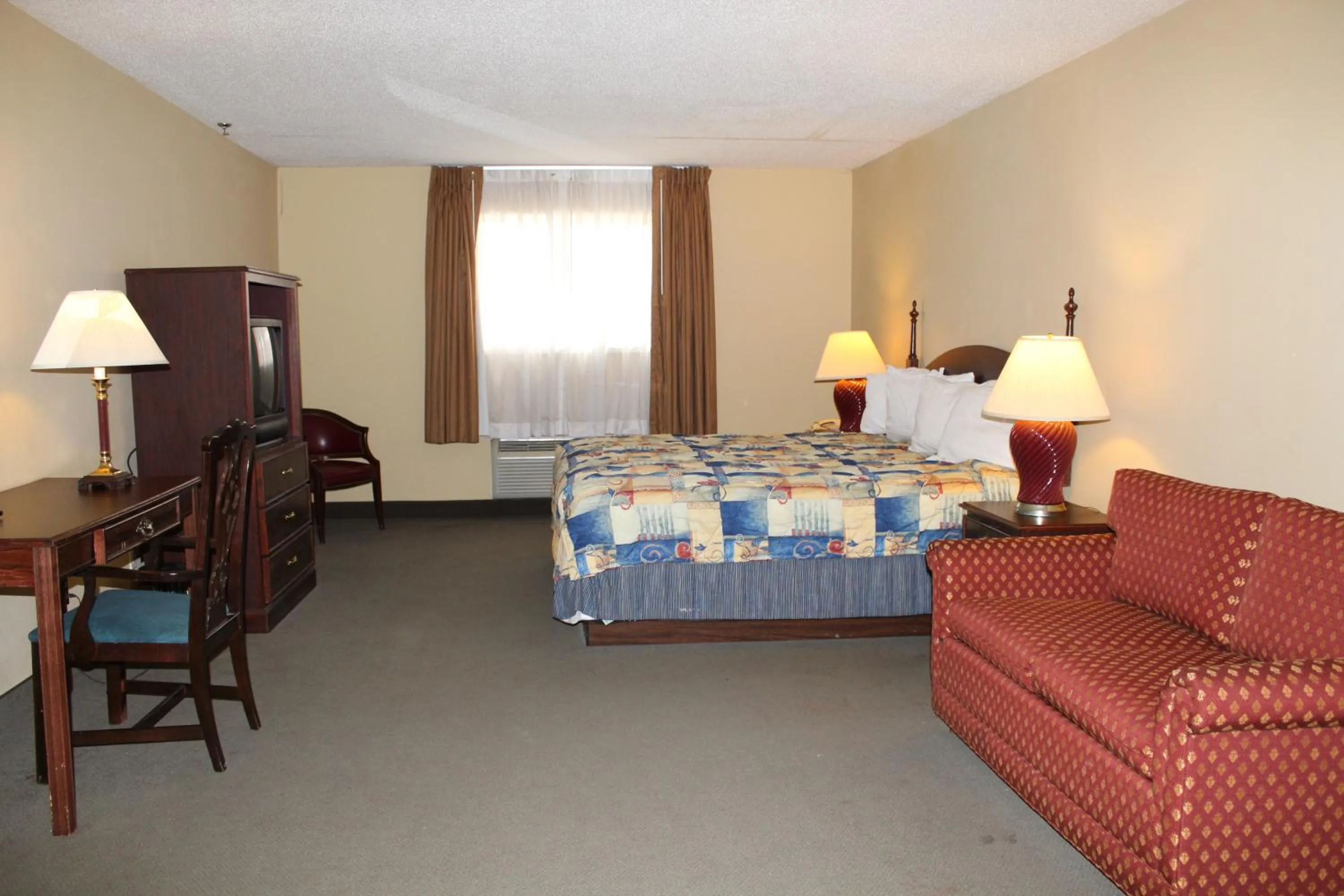 Bed in Mansion View Inn & Suites