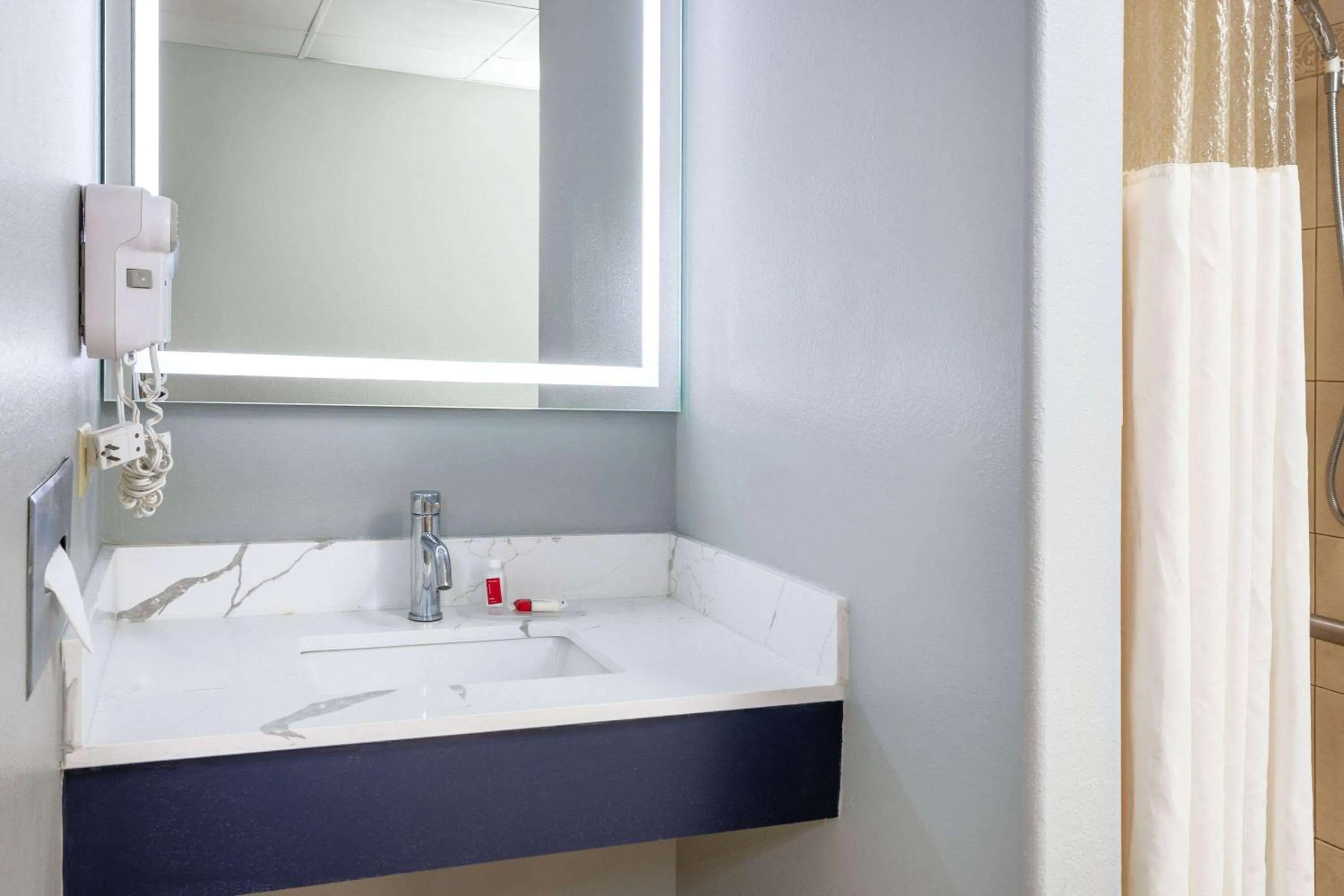 Shower in AmericInn by Wyndham Peoria