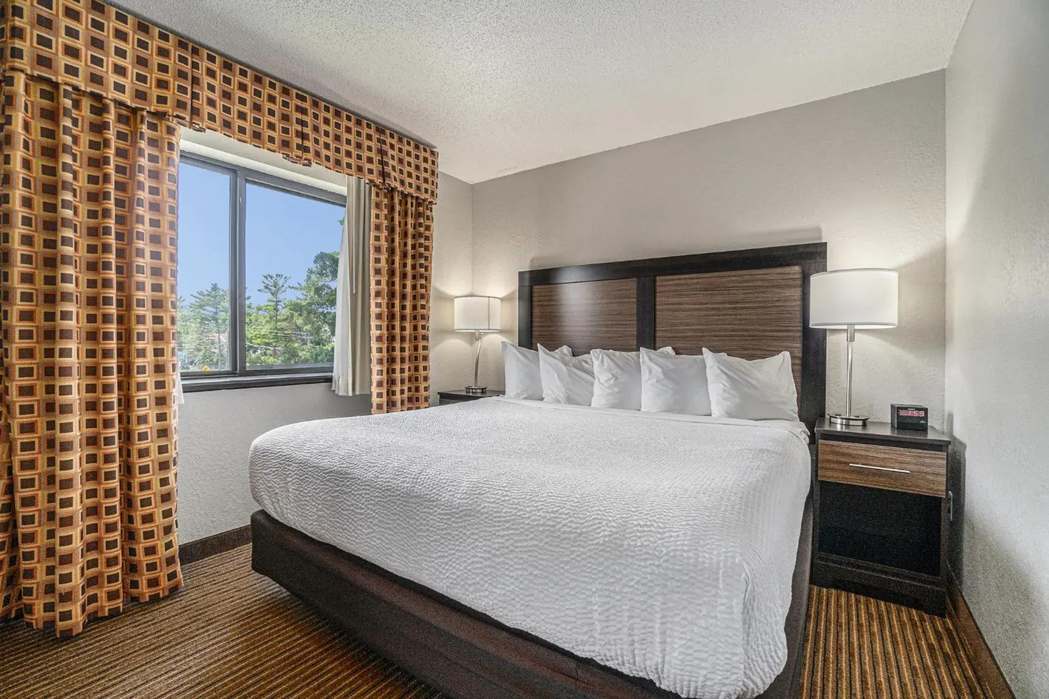 Bed in Days Inn & Suites by Wyndham Traverse City Bed in Days Inn & Suites by Wyndham Traverse City