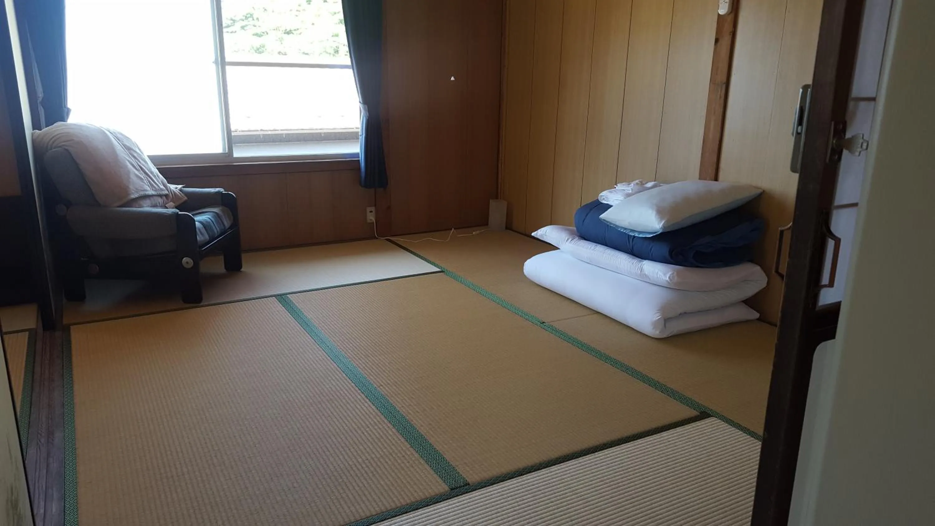 Seating area, Bed in Asobi Lodge