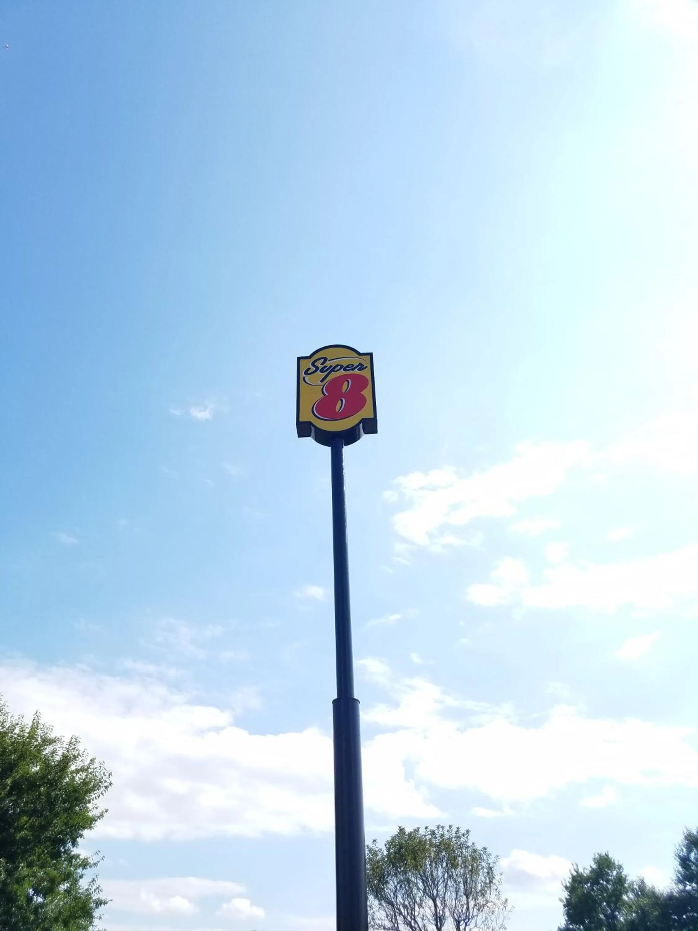 Property logo or sign in Super 8 by Wyndham DeKalb IL