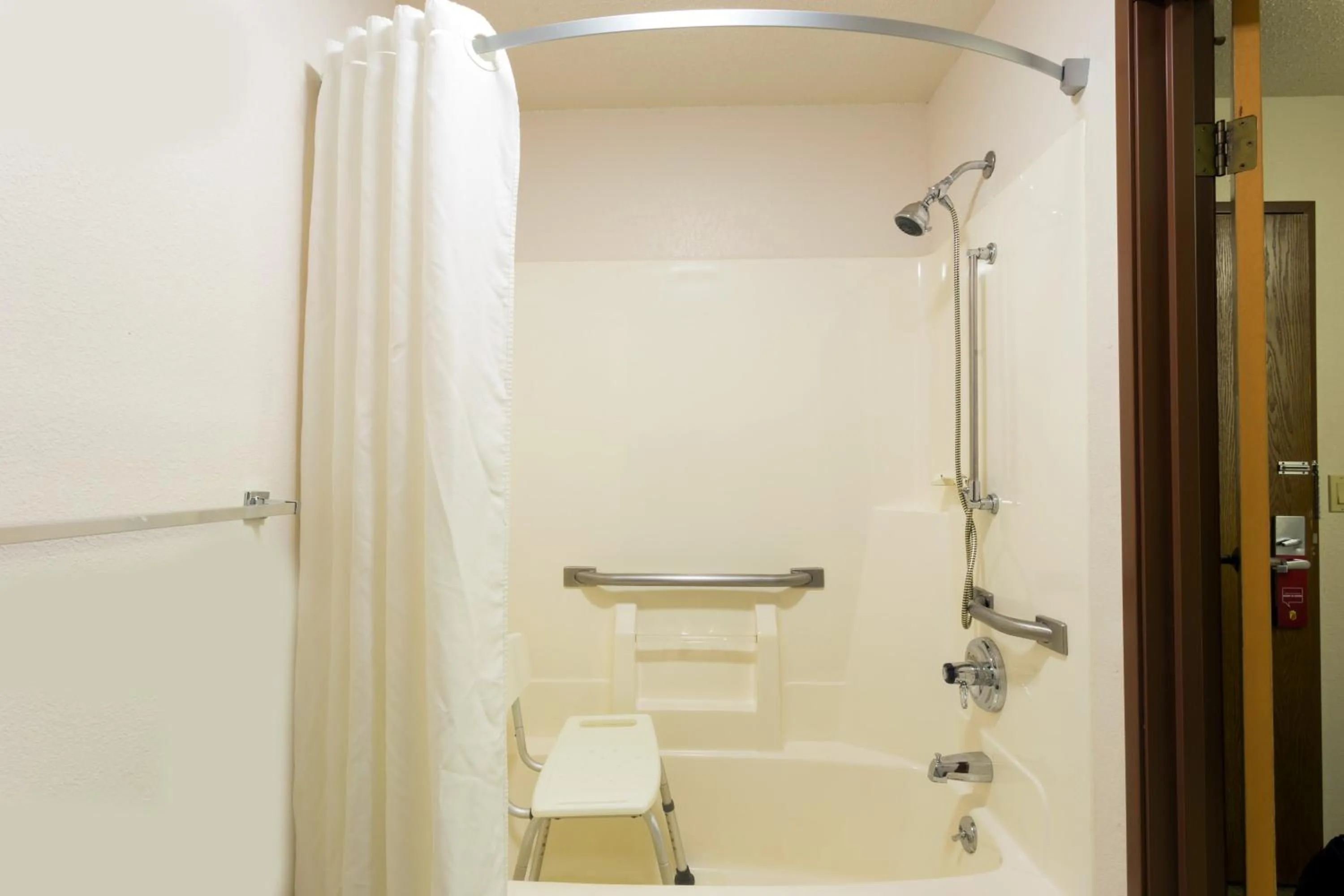 Bathroom in Super 8 by Wyndham DeKalb IL