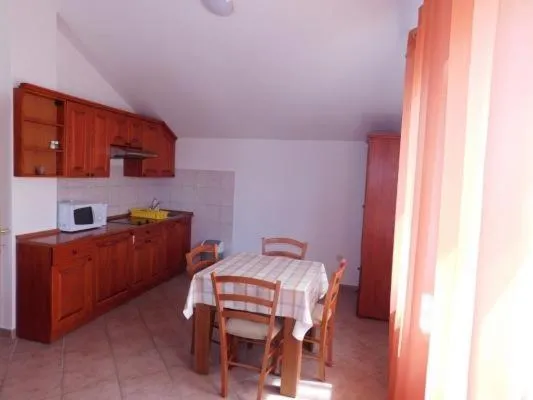 Kitchen or kitchenette in Apartments Sunset near the sandy beach - by TA Leut Agency