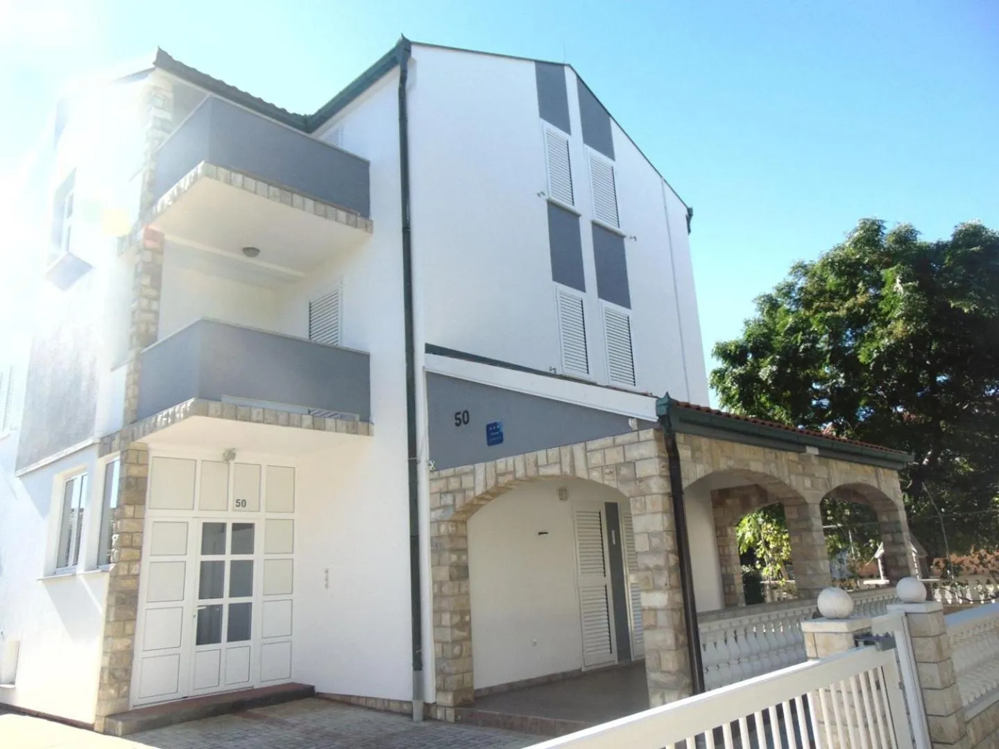 Property building in Apartments Sunset near the sandy beach - by TA Leut Agency