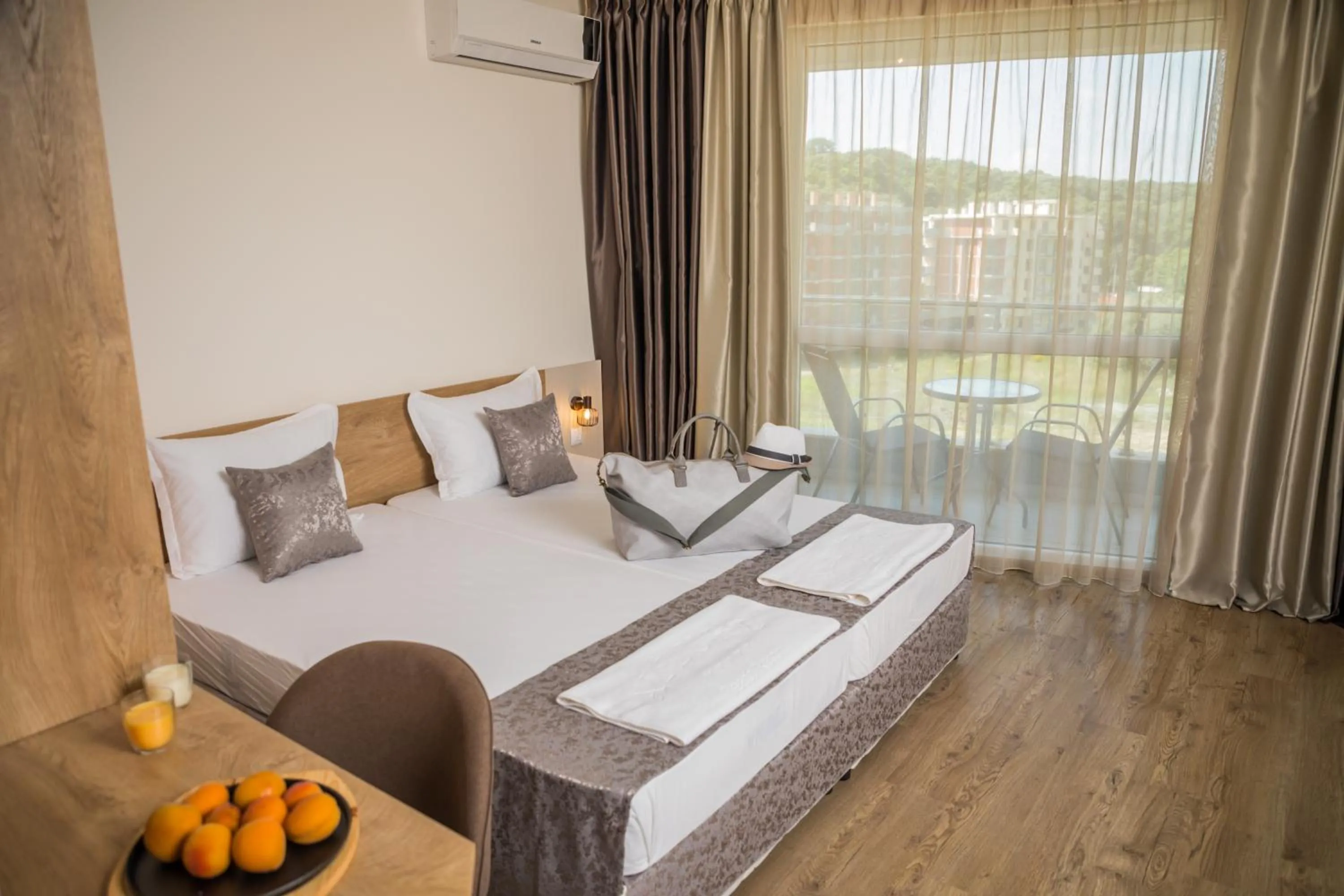 Bed in Allure Beach Resort Aparthotel