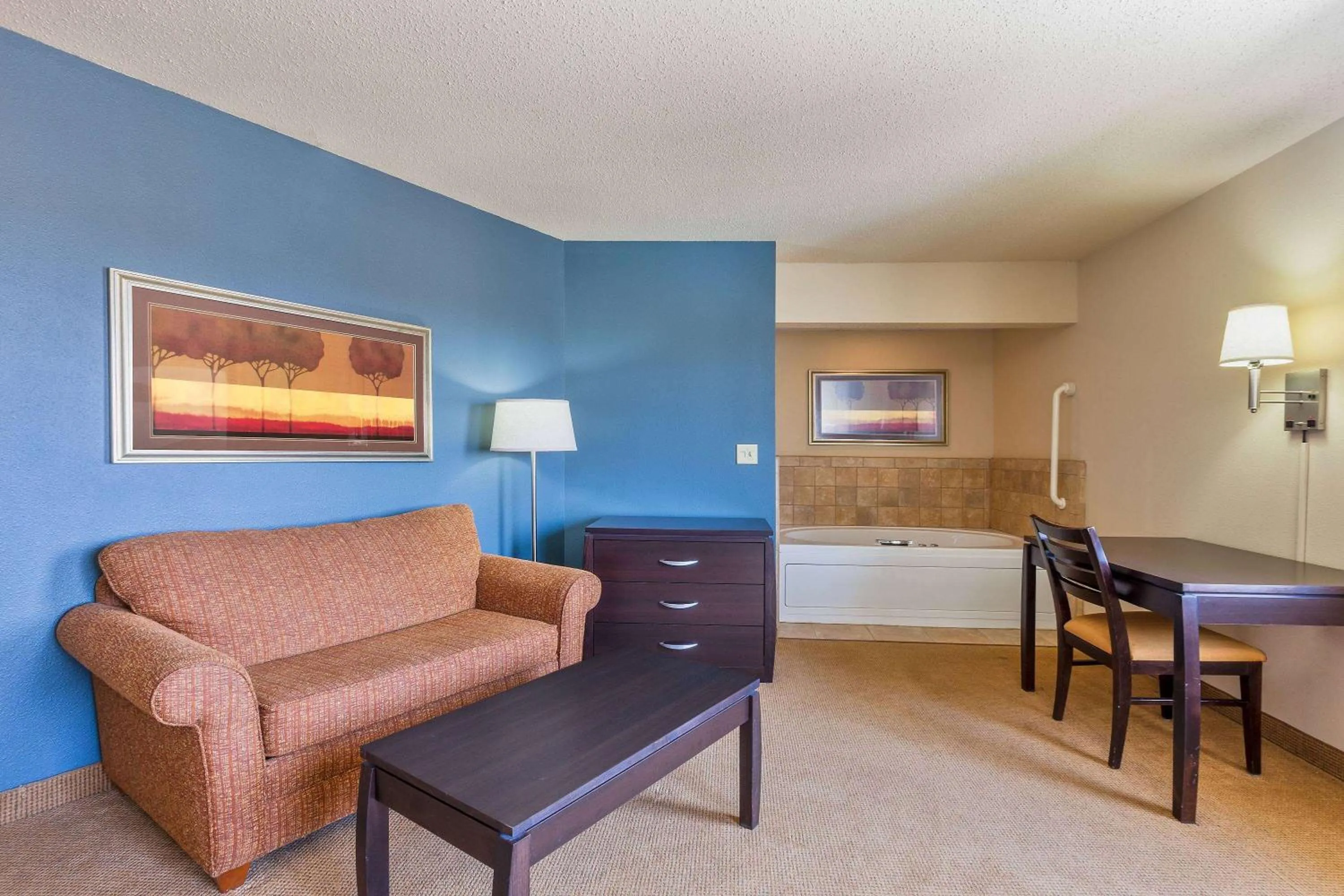 Living room in AmericInn by Wyndham Monmouth