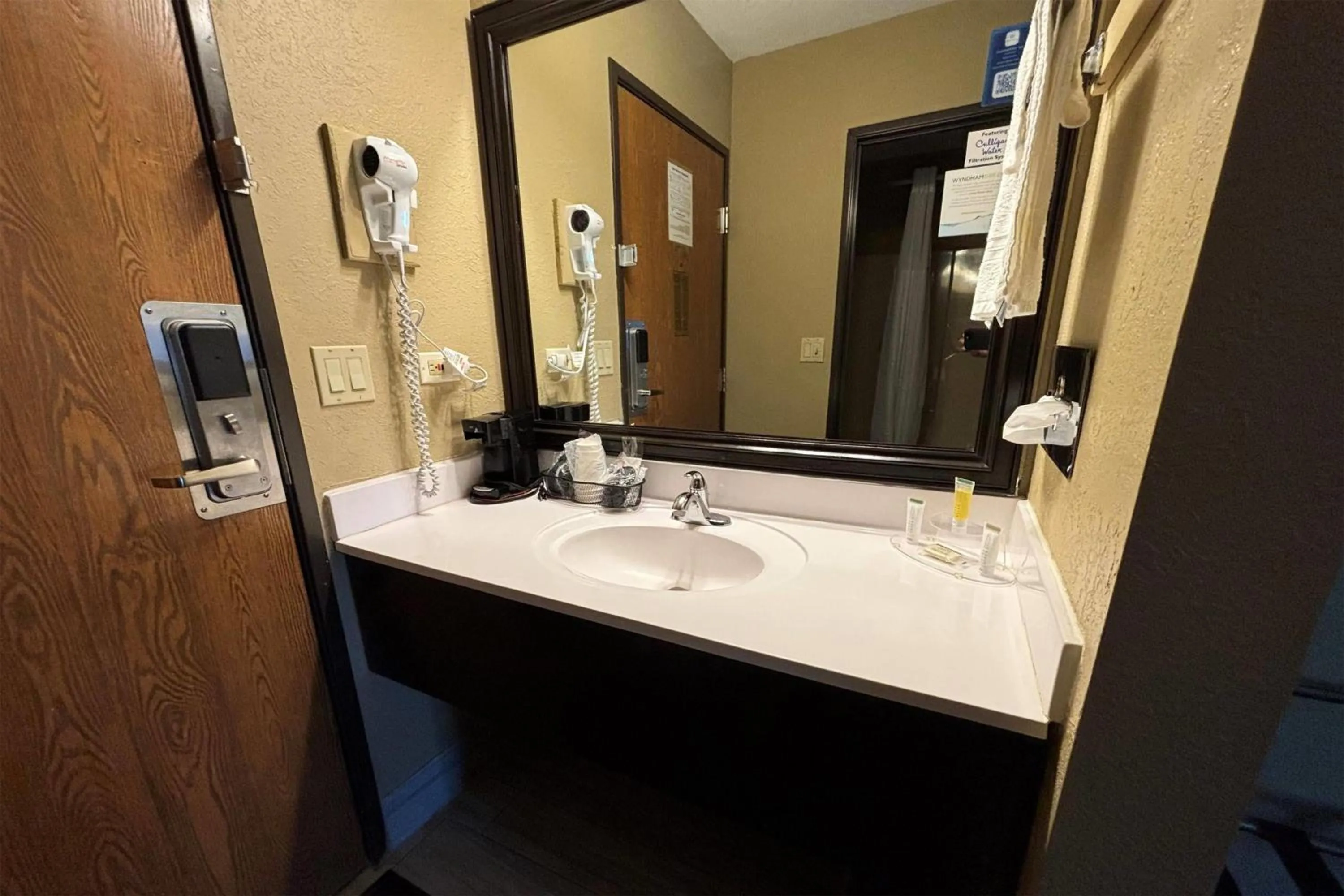 Bathroom in Super 8 by Wyndham McLean/Bloomington SW