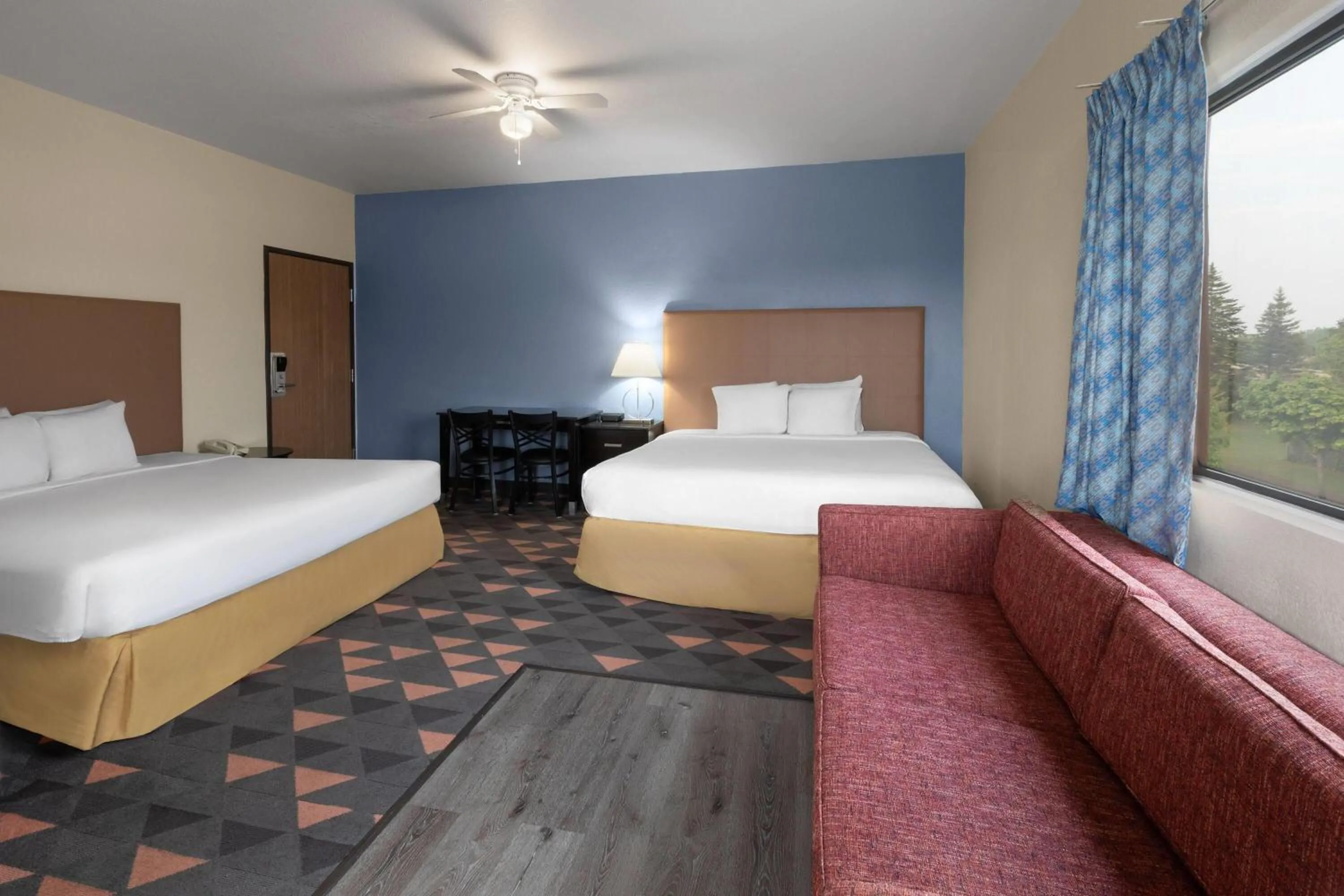 Photo of the whole room, Bed in Days Inn by Wyndham Mackinaw City - Bridgeview Area