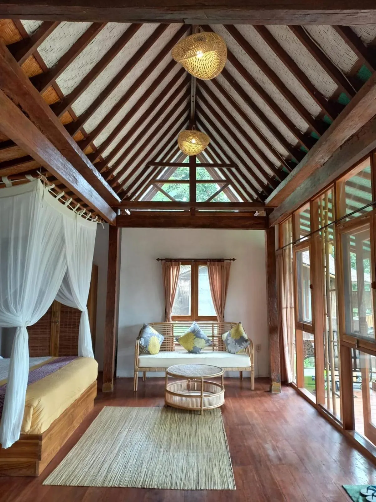 Seating area, Bed in Sang Tirta Resort
