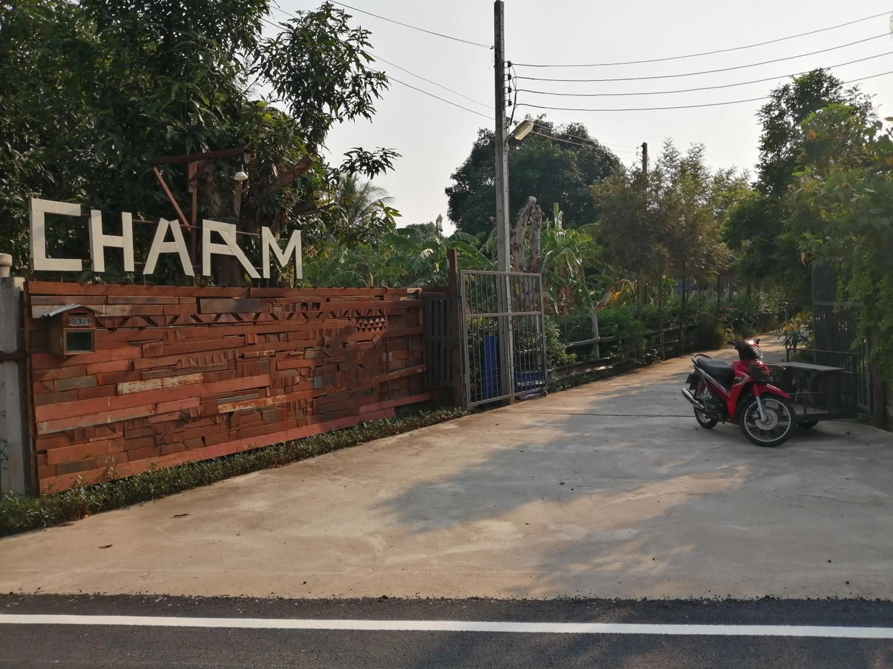 Property logo or sign in Rustic​ Charm​ Suphan​