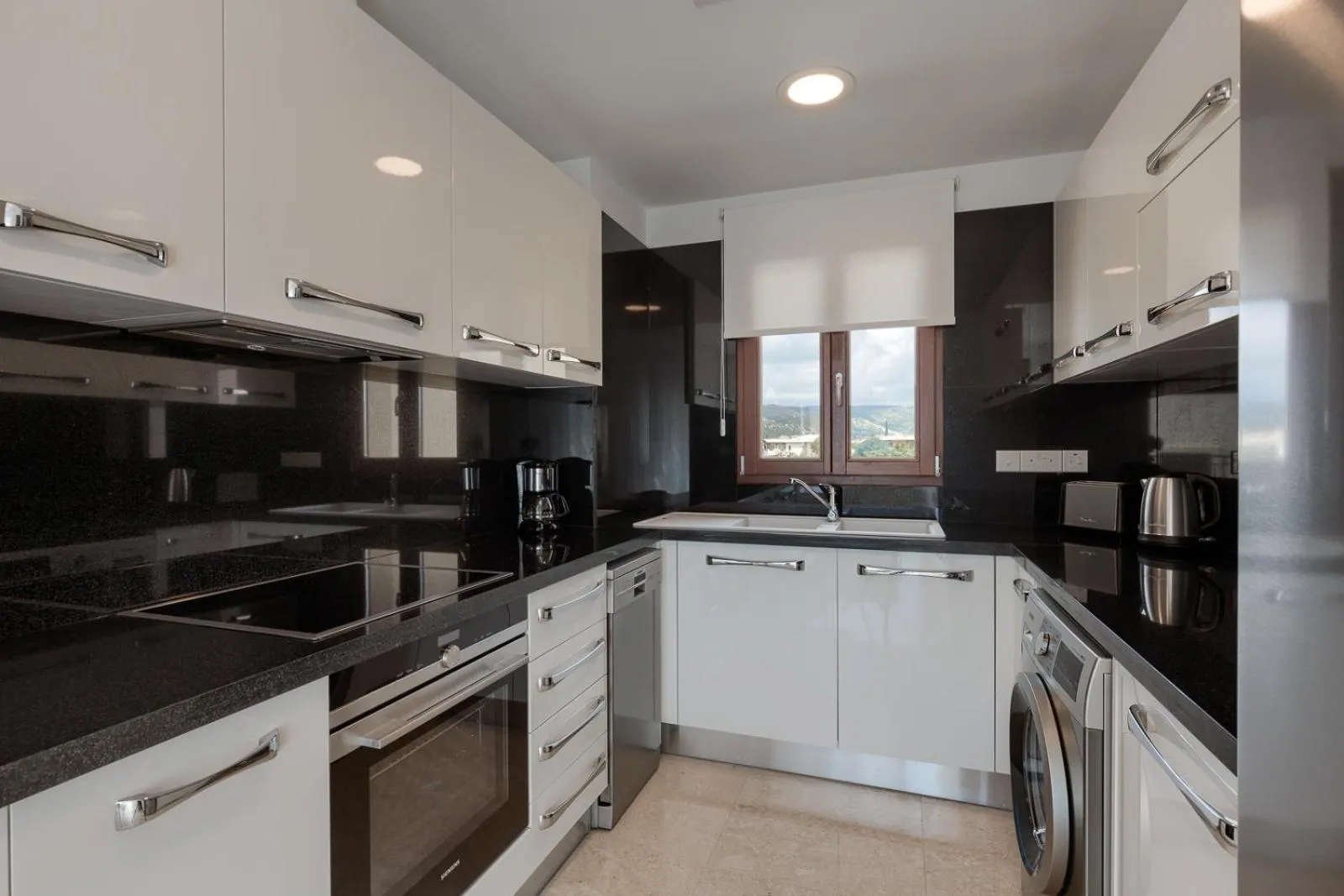 Kitchen or kitchenette in Aphrodite Hills Rentals - Premium Serviced Apartments