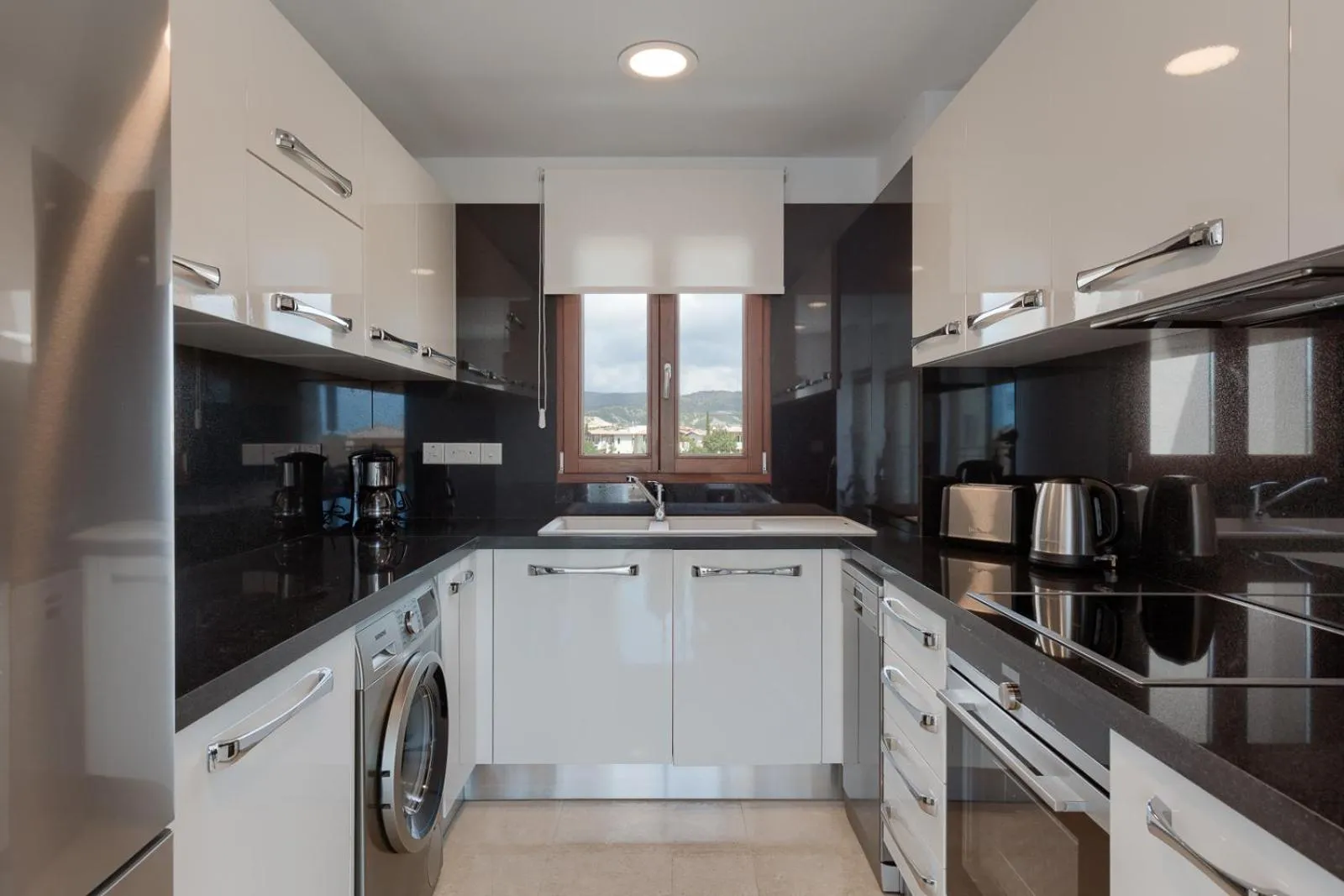Kitchen or kitchenette in Aphrodite Hills Rentals - Premium Serviced Apartments