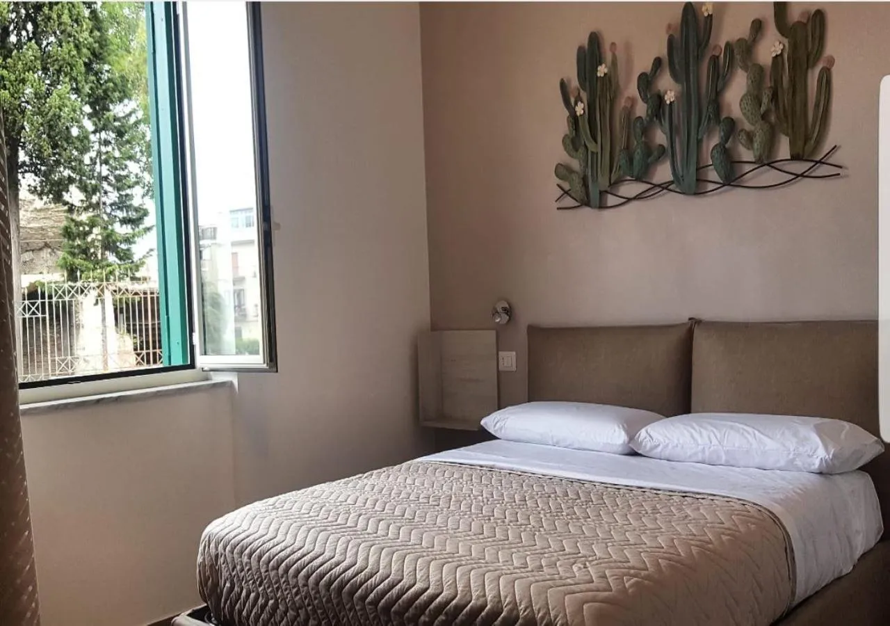 Bed in DIMORA FLEGREA room & breakfast