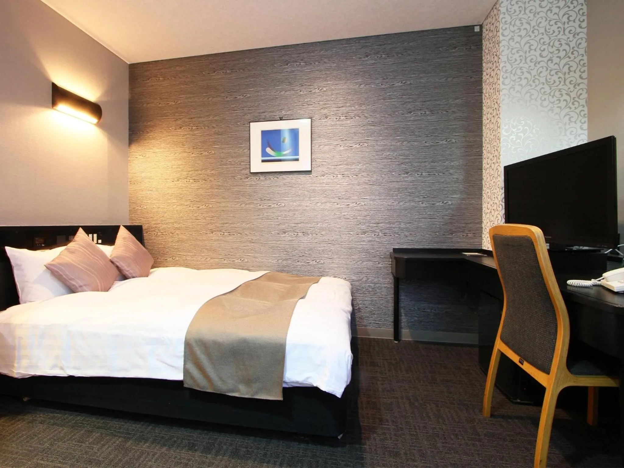 Bed in Hotel AreaOne Chitose