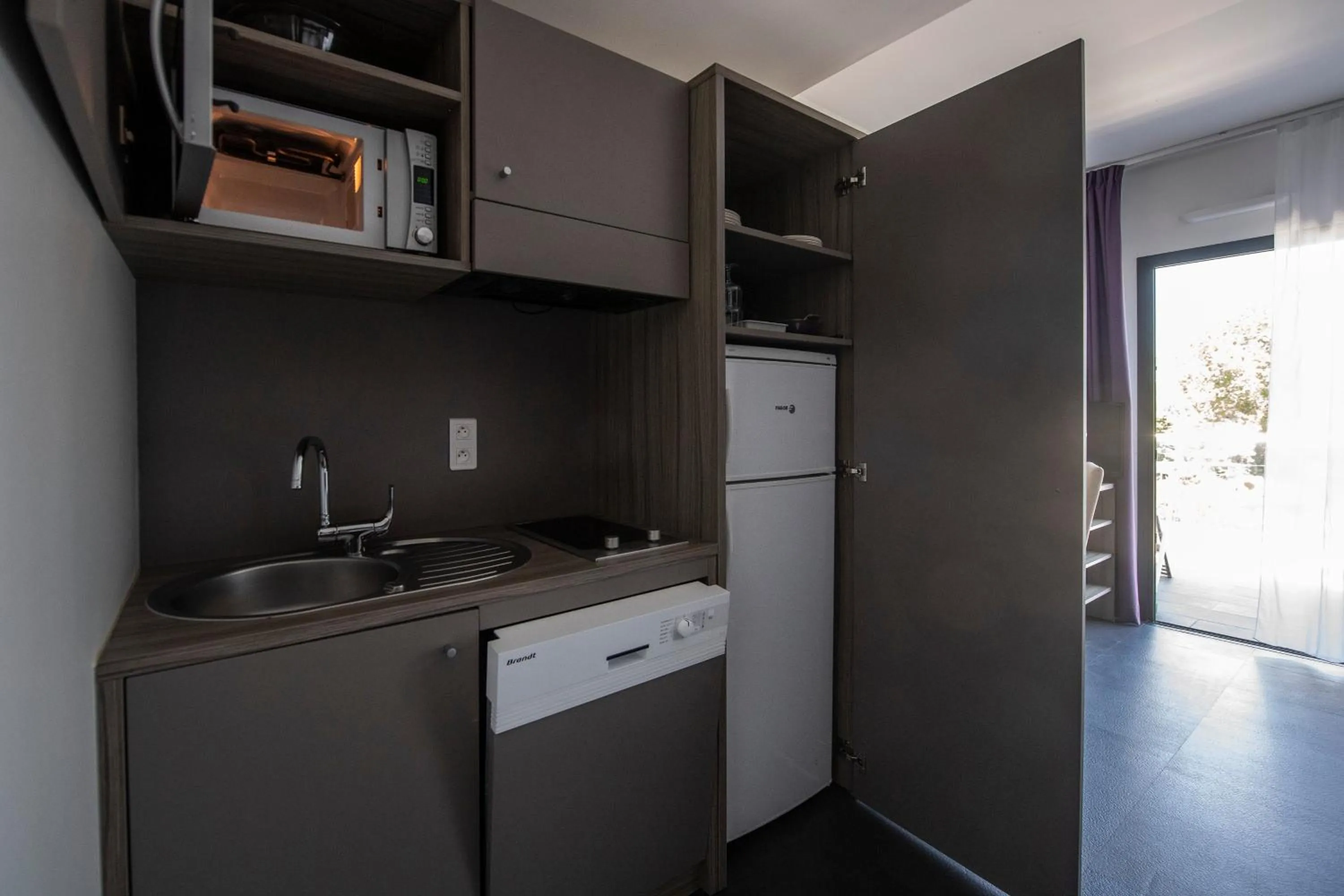 Kitchen or kitchenette in Suite Home Porticcio