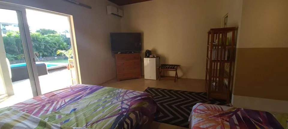 Photo of the whole room, Bed in TEA TAHITI Holidays