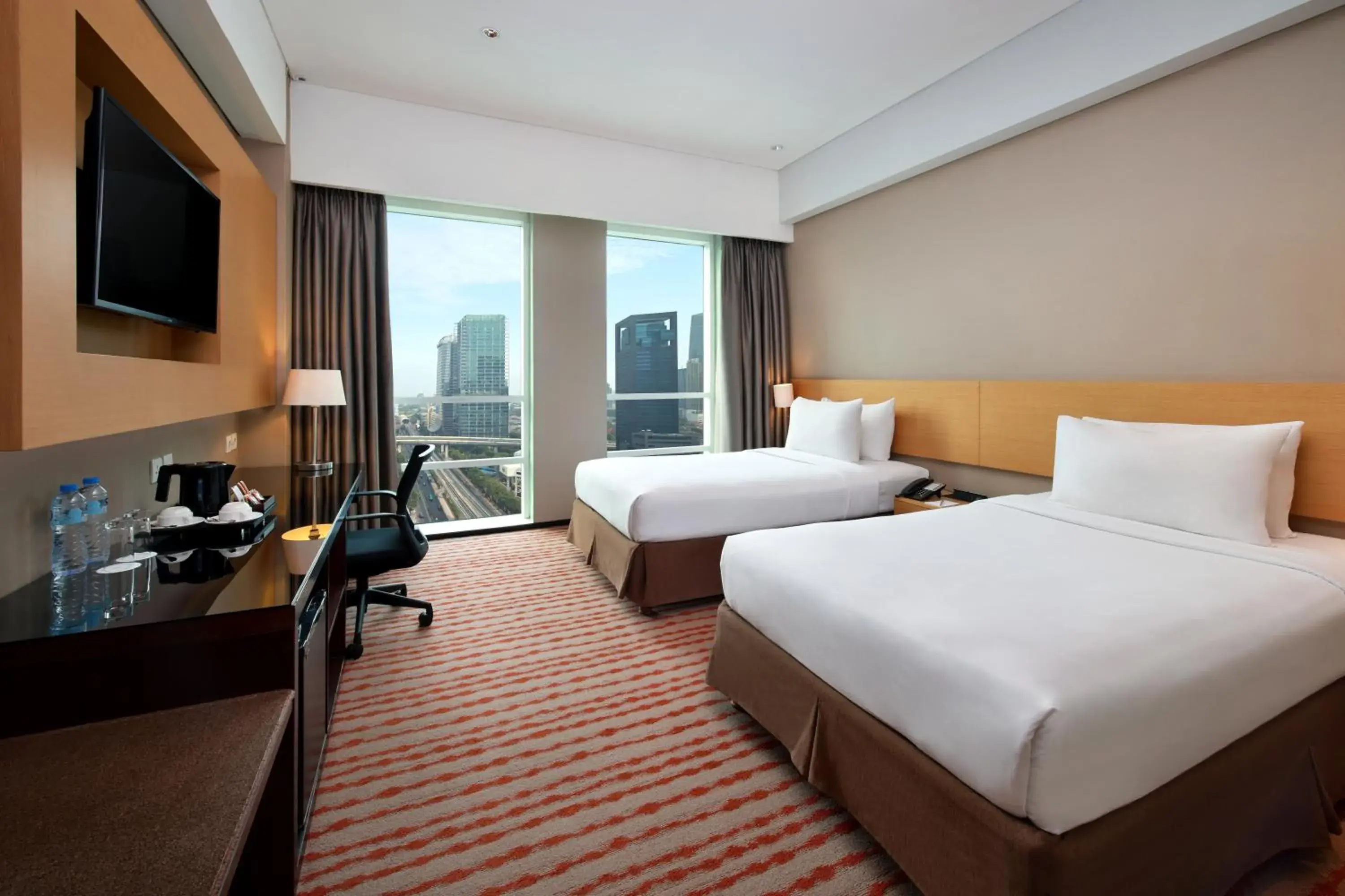 Bed in JS Luwansa Hotel & Convention Center Bed in JS Luwansa Hotel & Convention Center