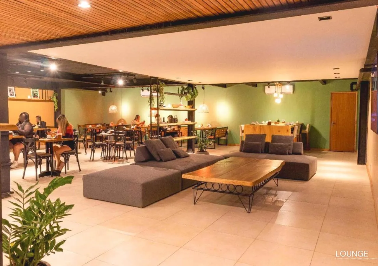 Communal lounge/ TV room in Grão Pará Petrópolis
