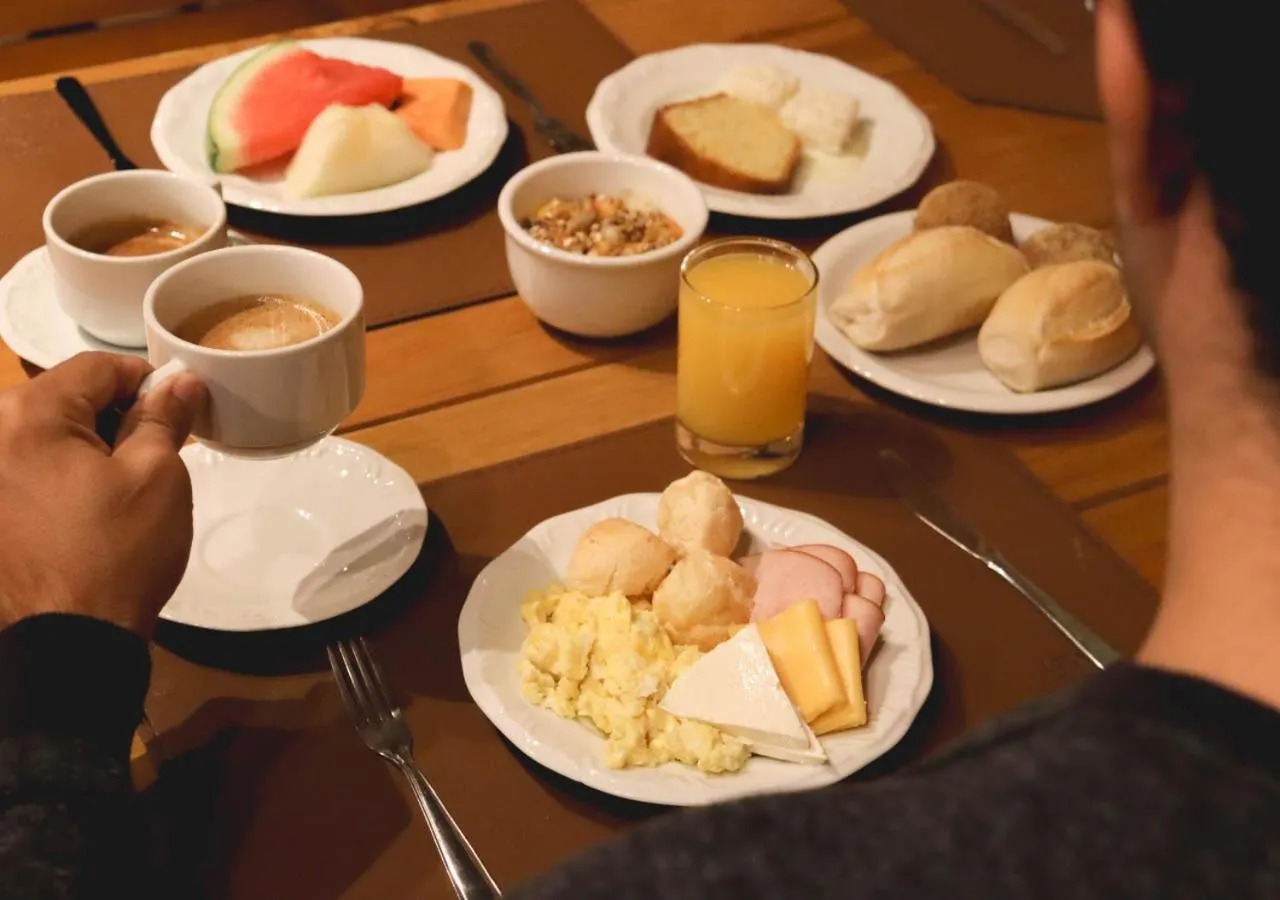 Communal lounge/ TV room in Grão Pará Petrópolis