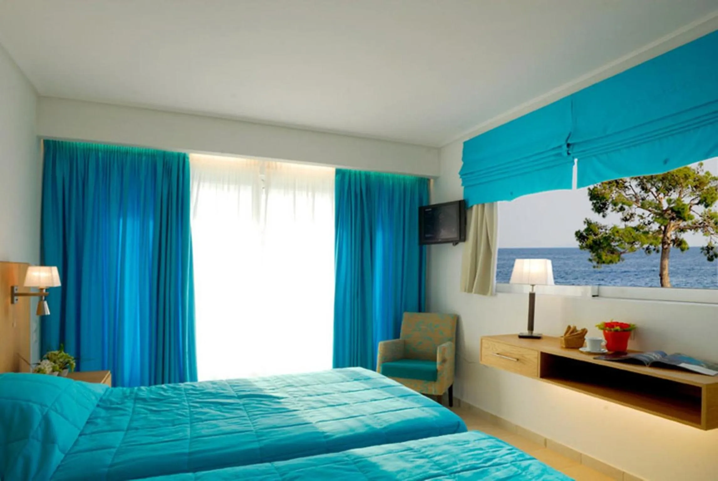 Bed in Kinetta Beach Resort and Spa