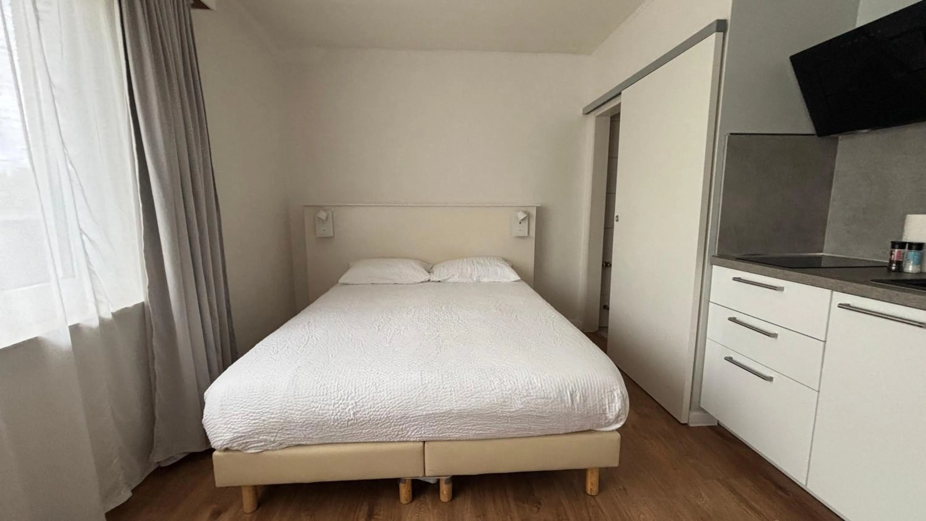 Bed in Aramis Studio Hotel