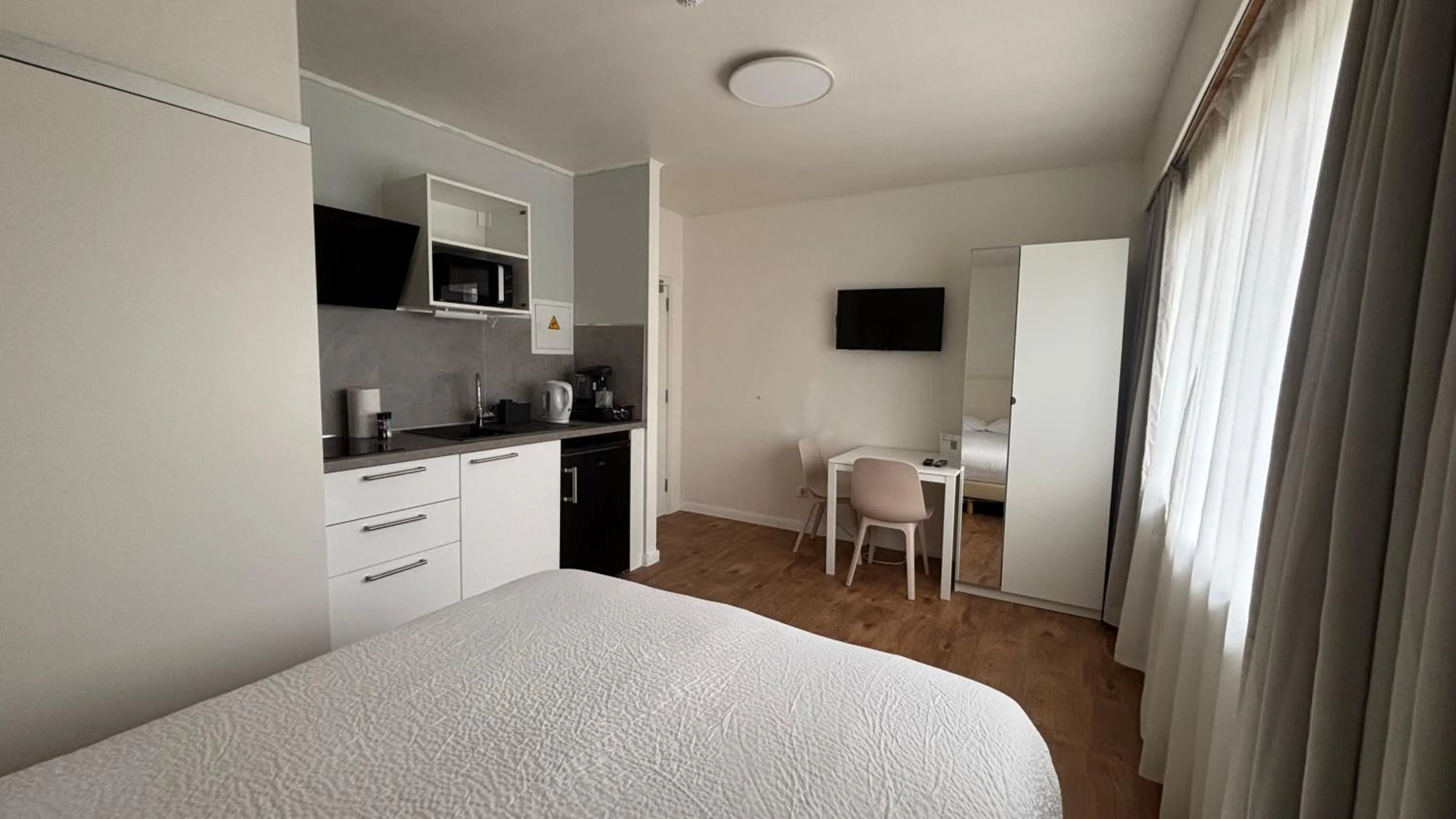 Bed in Aramis Studio Hotel