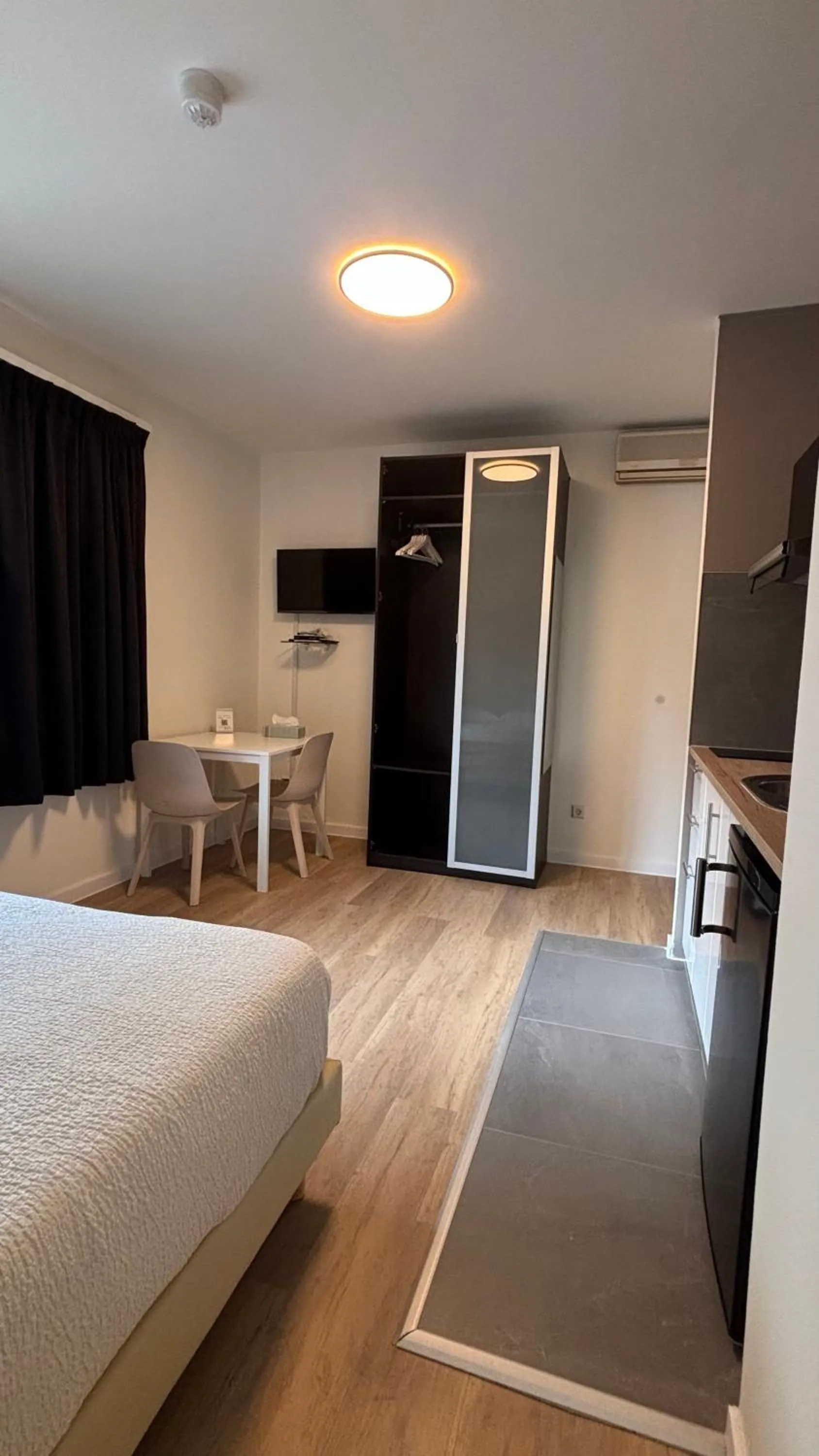 Bed in Aramis Studio Hotel