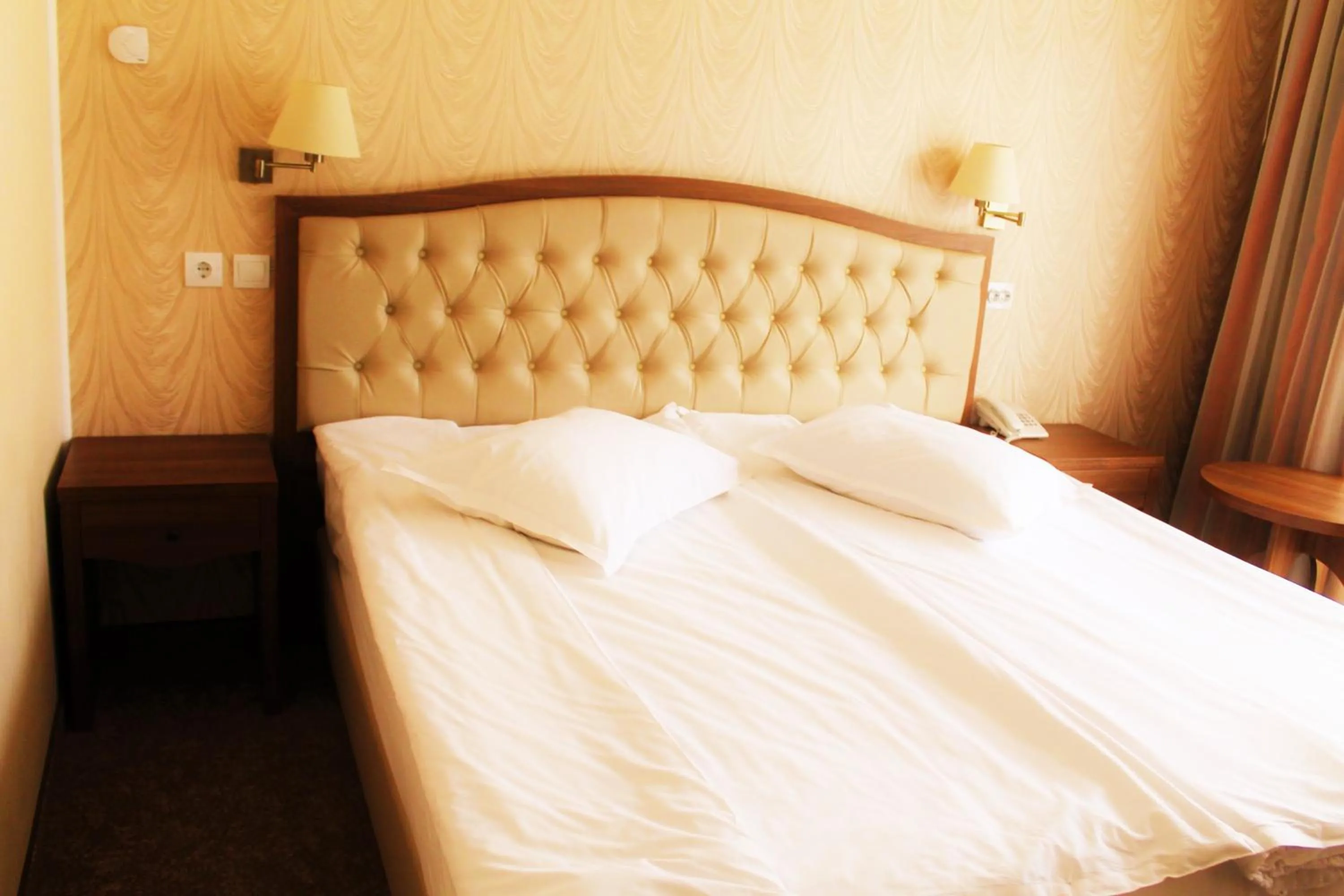 Bed in Hotel Crisalpin