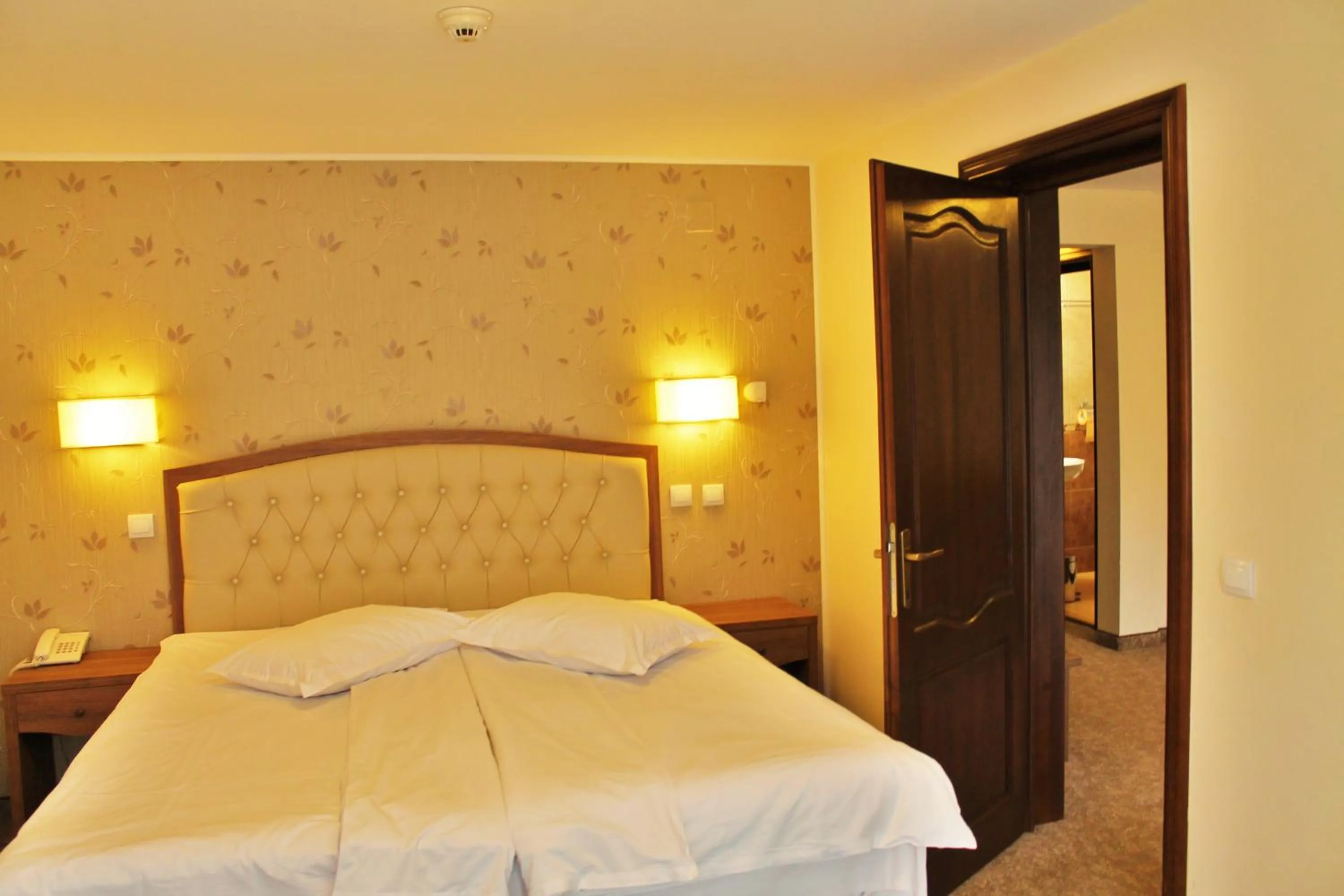 Bed in Hotel Crisalpin