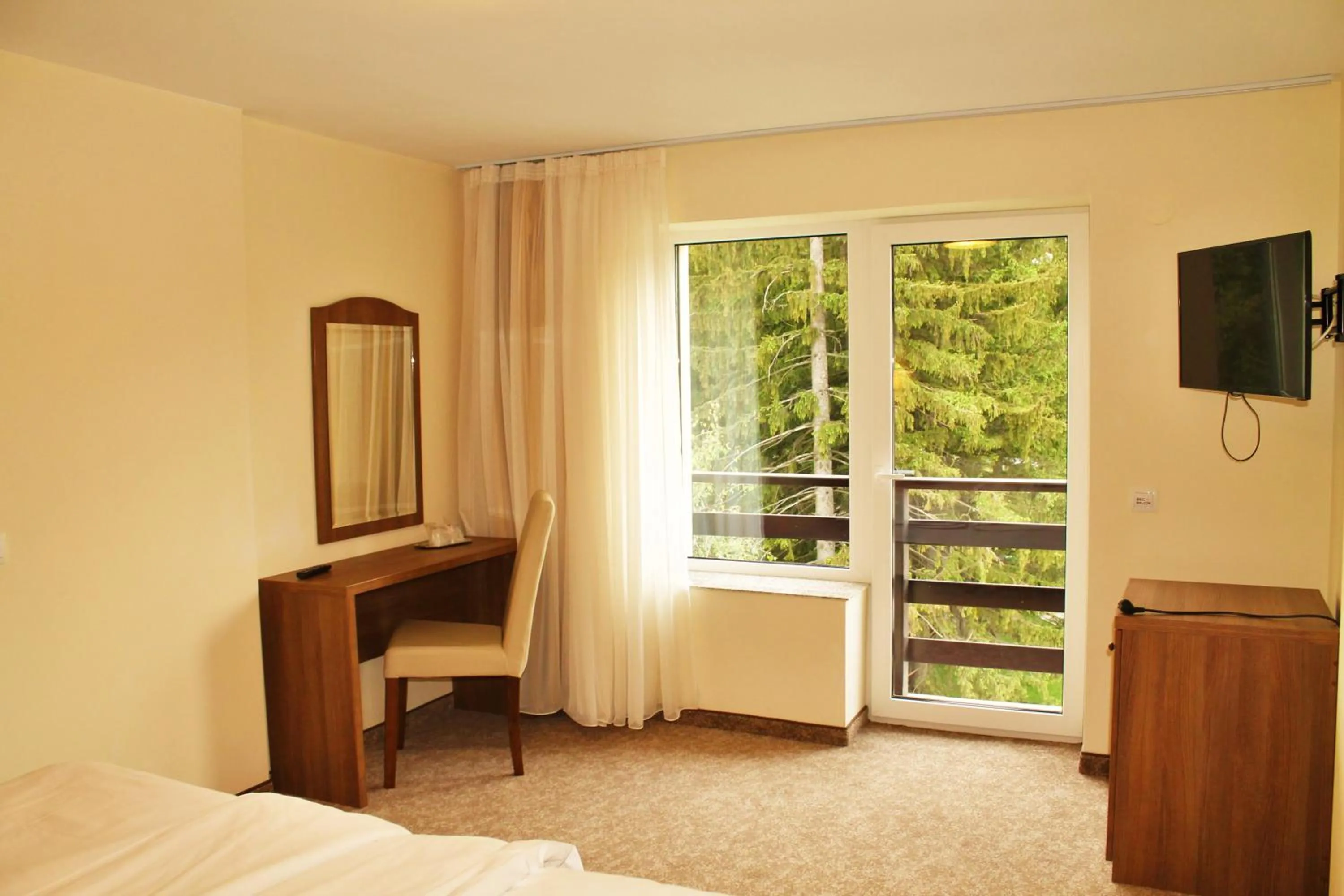 View (from property/room), Bed in Hotel Crisalpin
