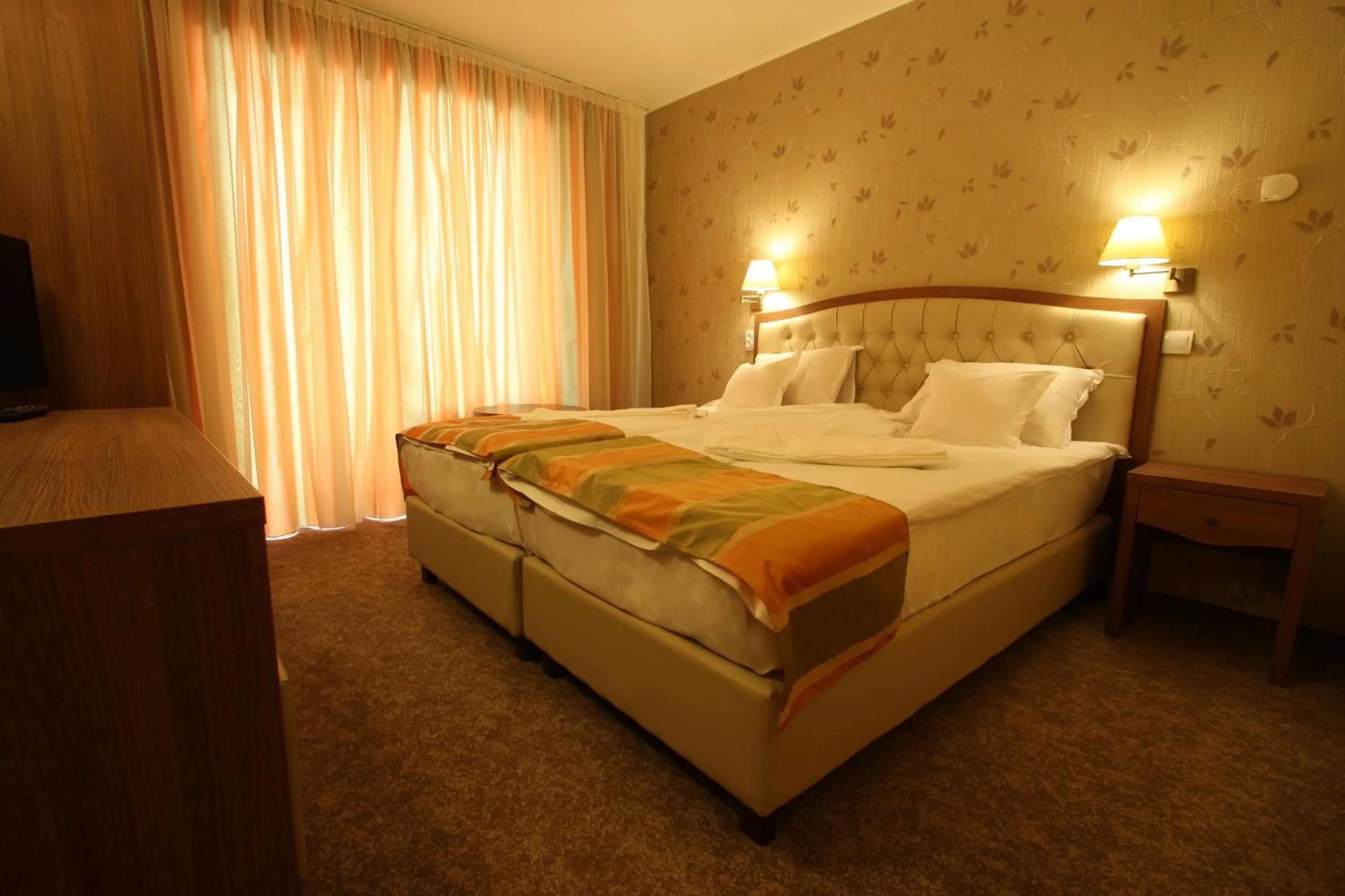 Bed in Hotel Crisalpin