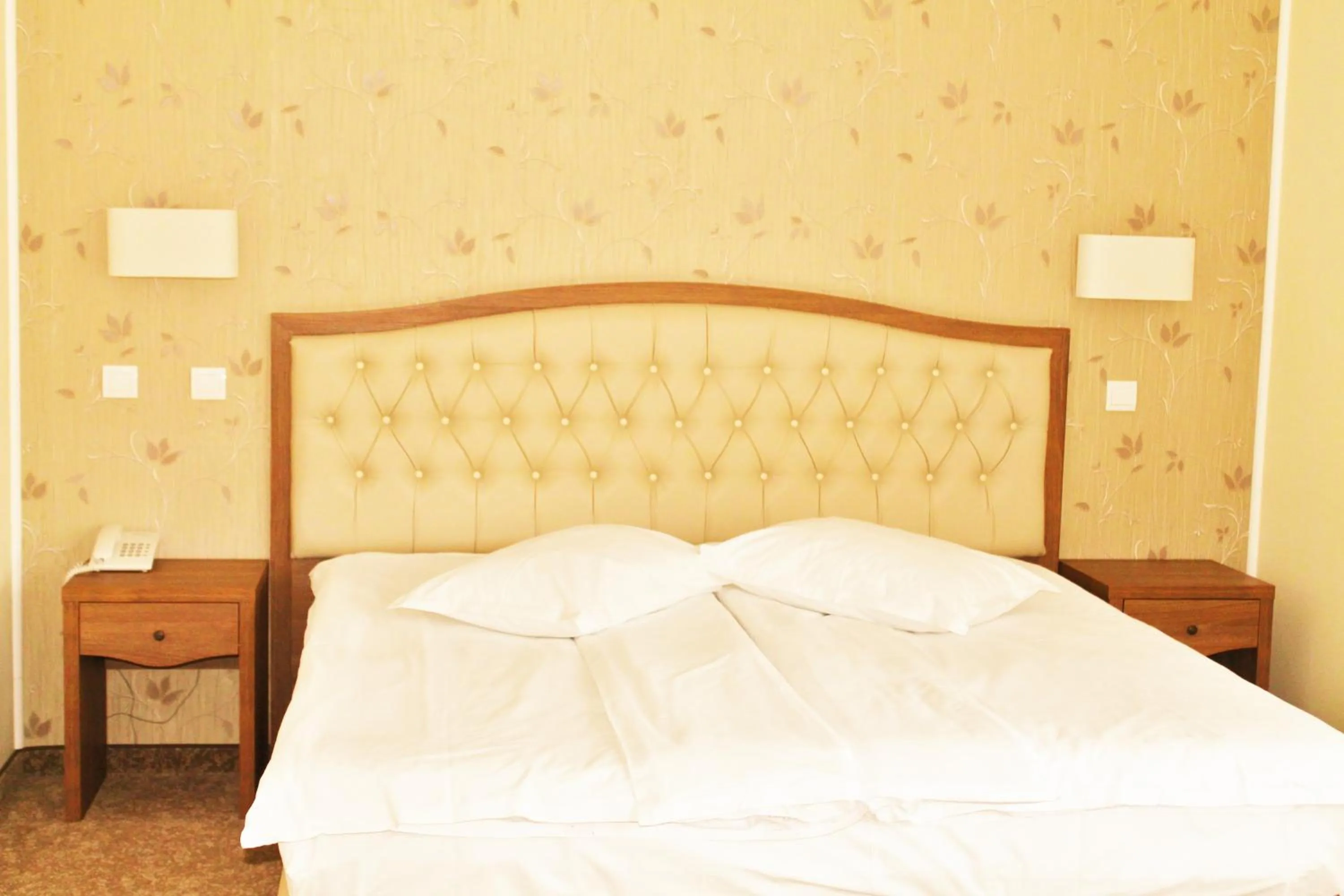 Bed in Hotel Crisalpin