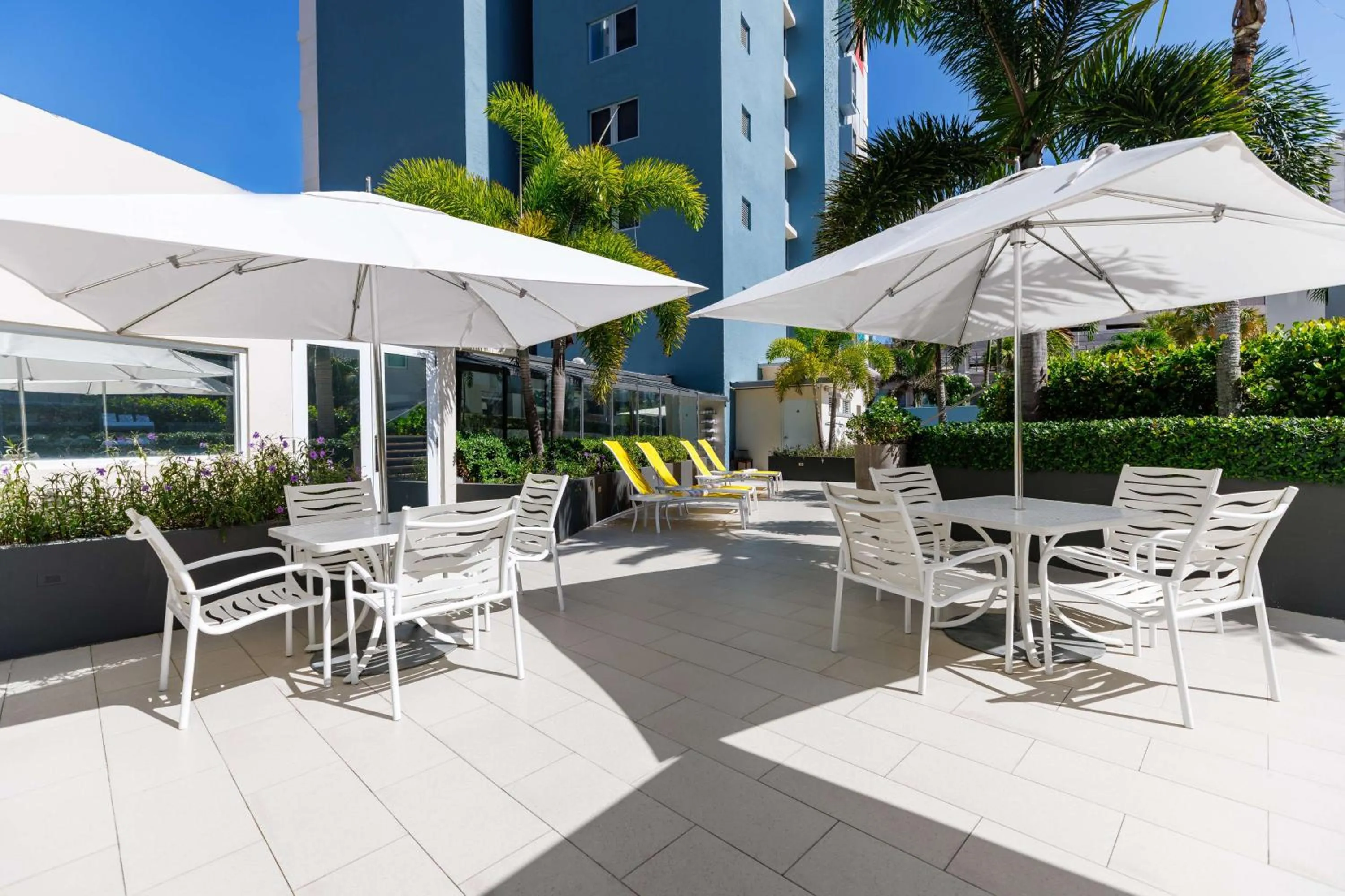 Patio in Condado Palm Inn San Juan, Tapestry Collection by Hilton