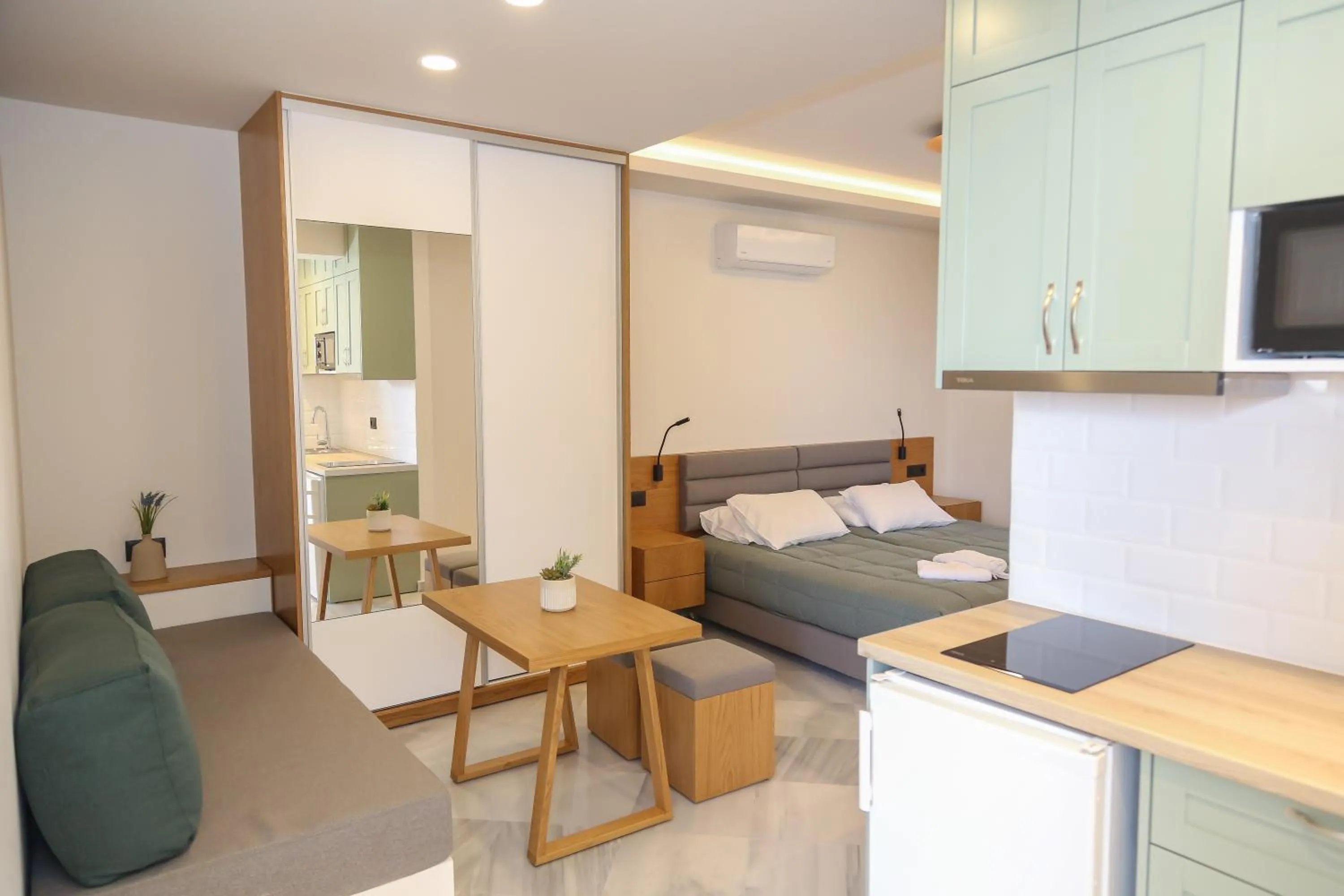 Seating area, Bed in Heaven Apartments