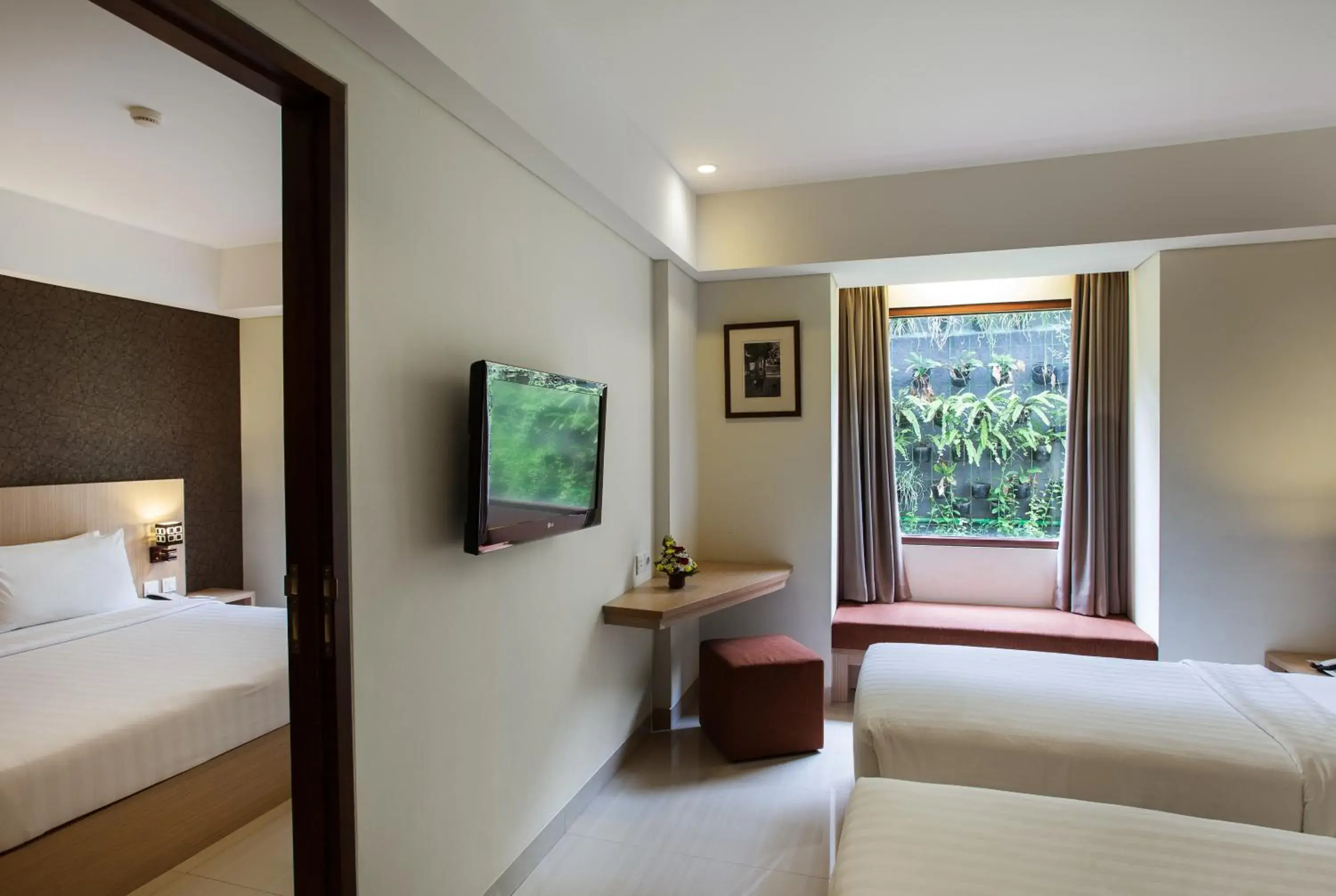 Garden view, Bed in Sense Sunset Hotel Seminyak Garden view, Bed in Sense Sunset Hotel Seminyak