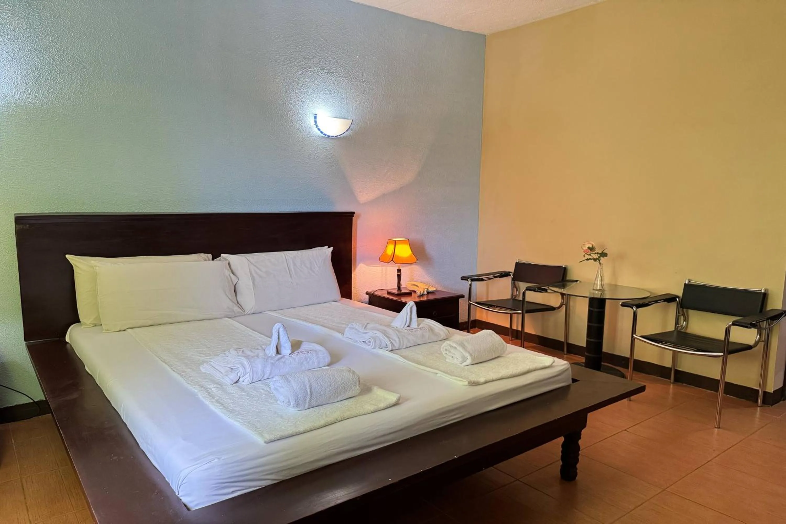 Bed in OveMar Resort Hotel near Vigan