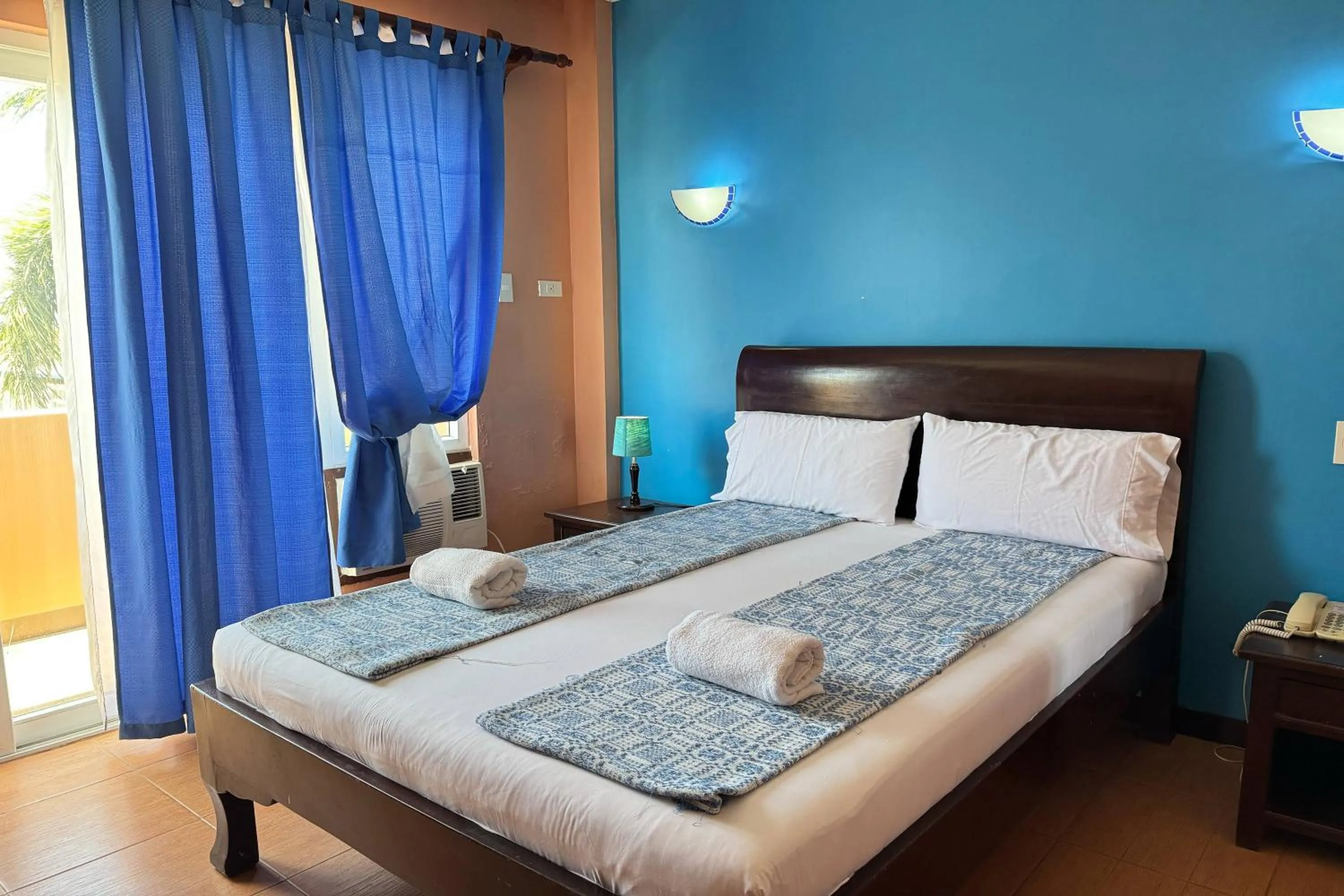 Bed in OveMar Resort Hotel near Vigan