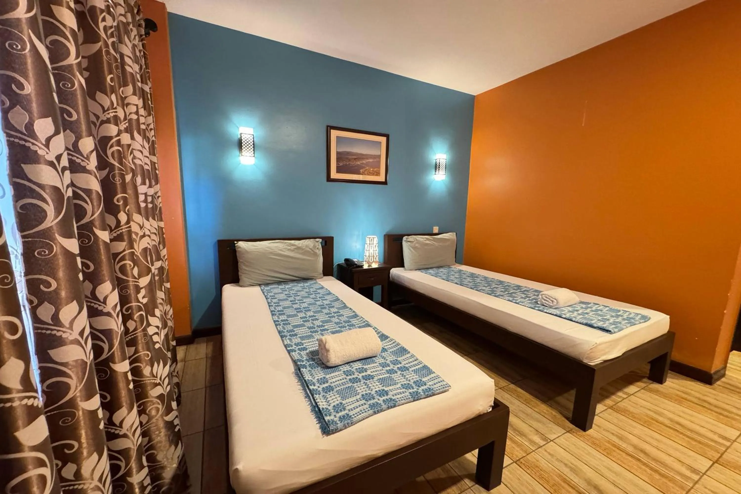 Bed in OveMar Resort Hotel near Vigan